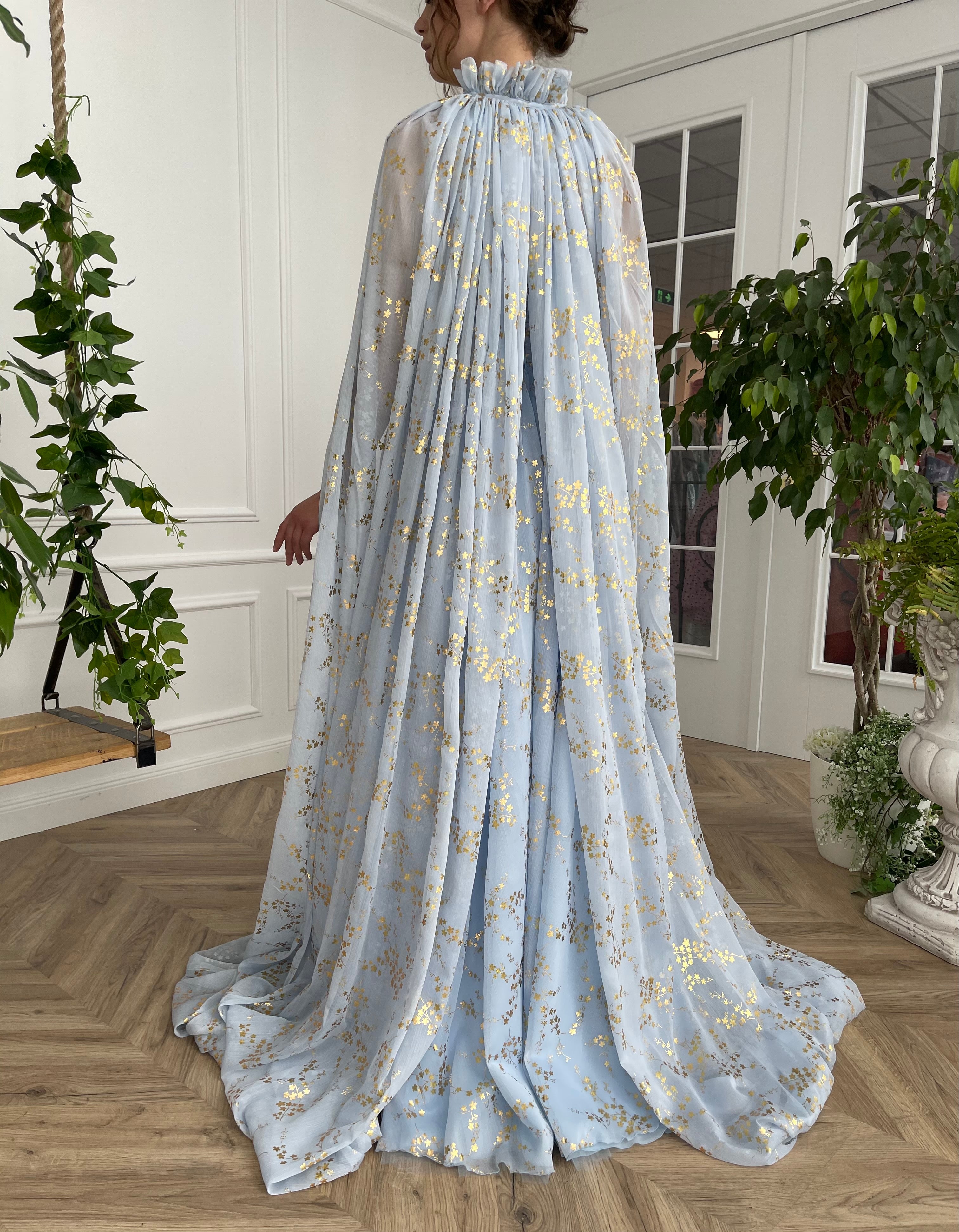 Blue A-Line dress with no sleeves and cape