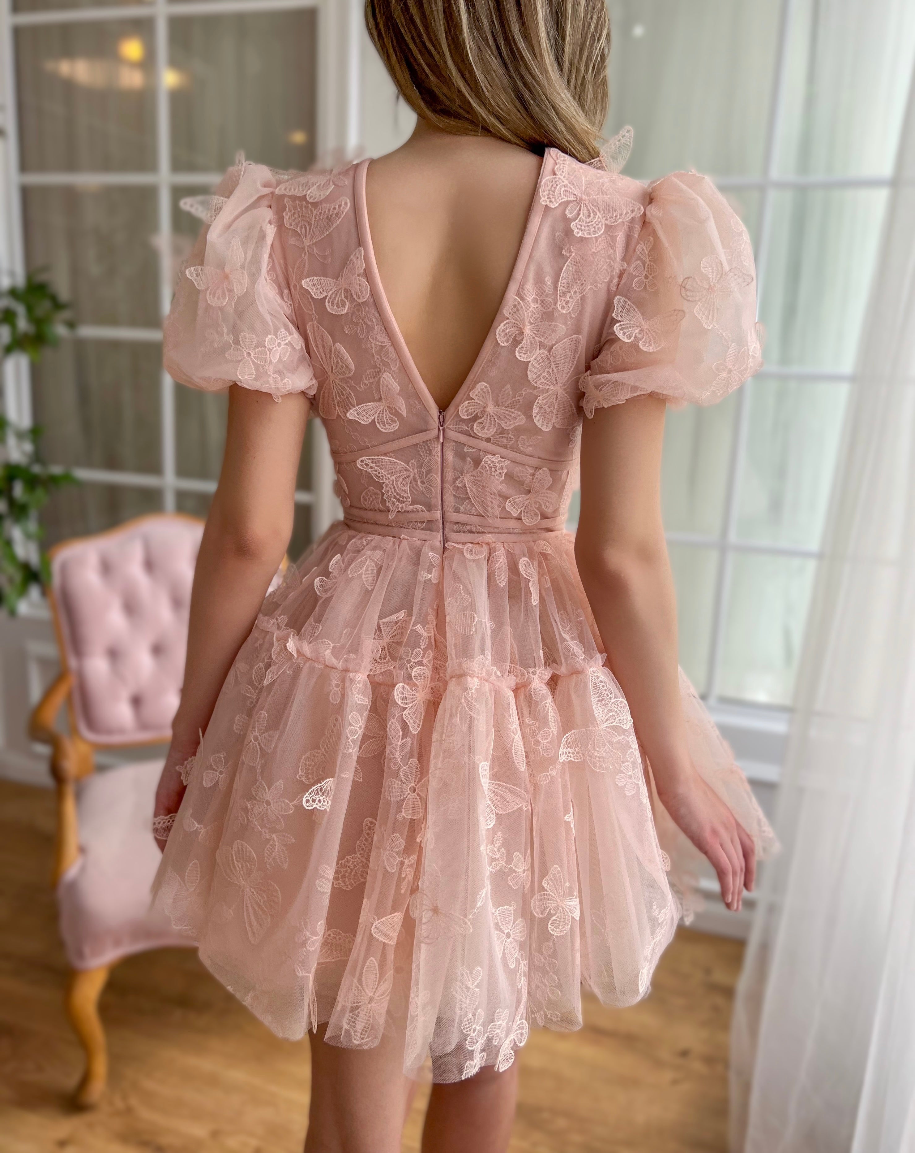 Pink mini dress with short sleeves, v-neck and embroidered butterflies