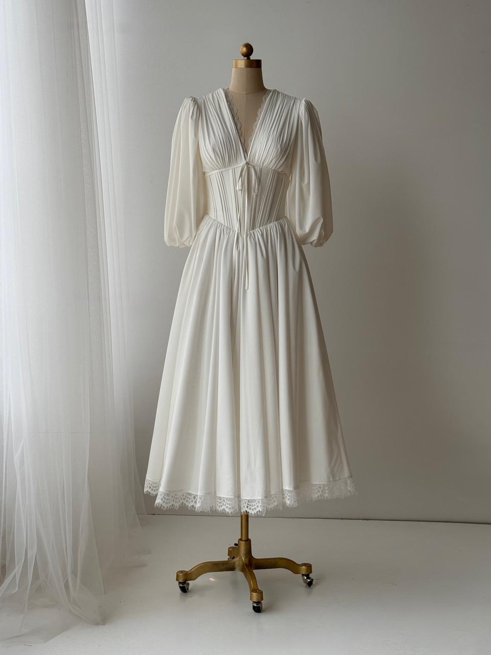White bridal midi dress with short sleeves, v-neck and embroidered lace
