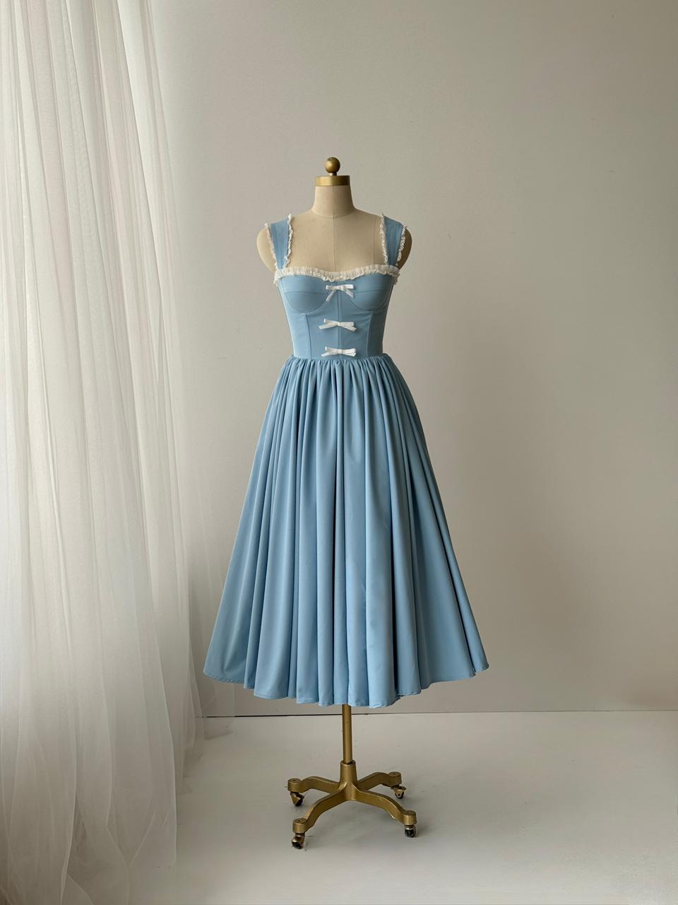 Light blue midi dress with straps, embroidered bows and lace