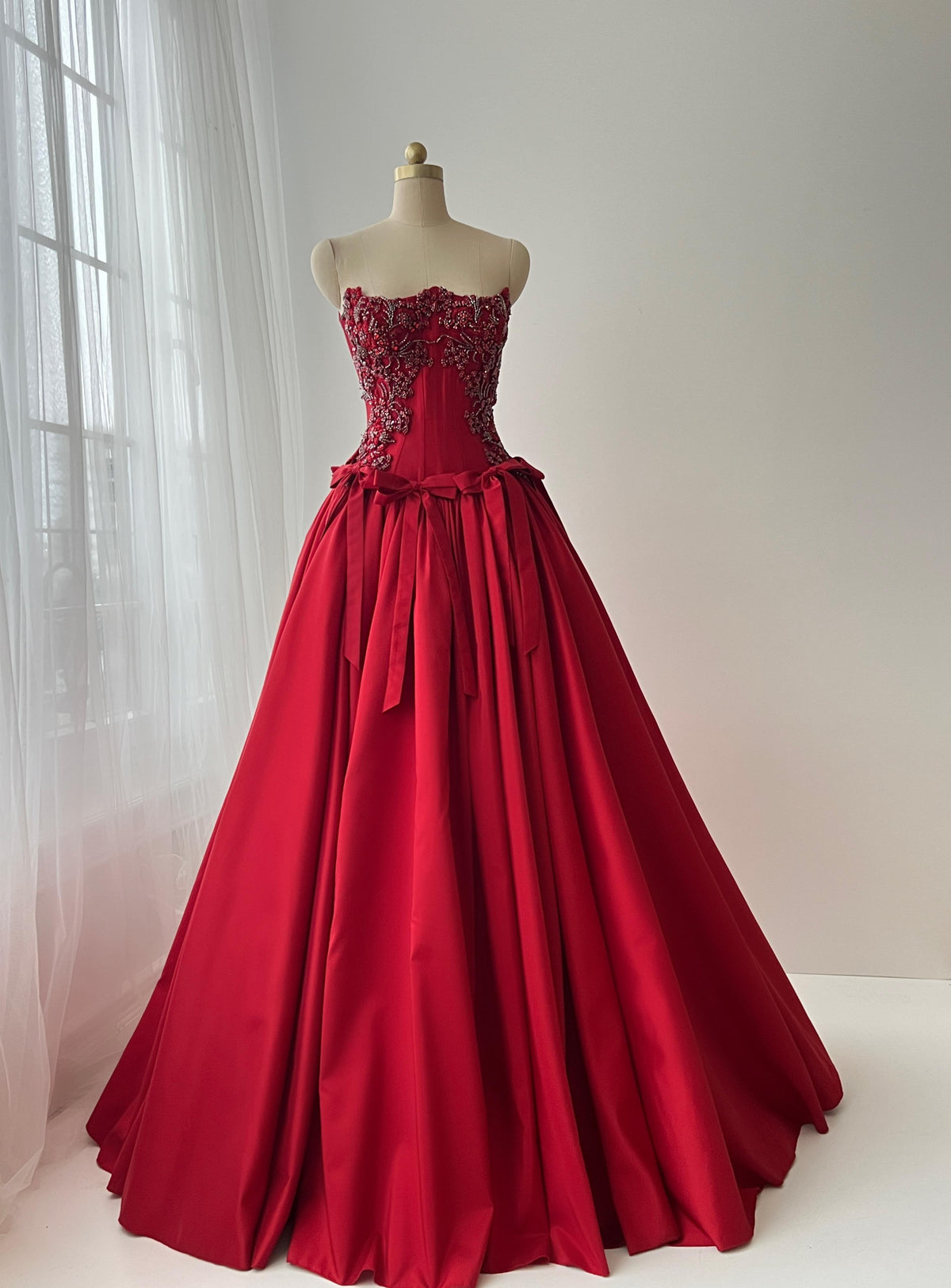 Red A-Line dress with embroidery, bows and no sleeves