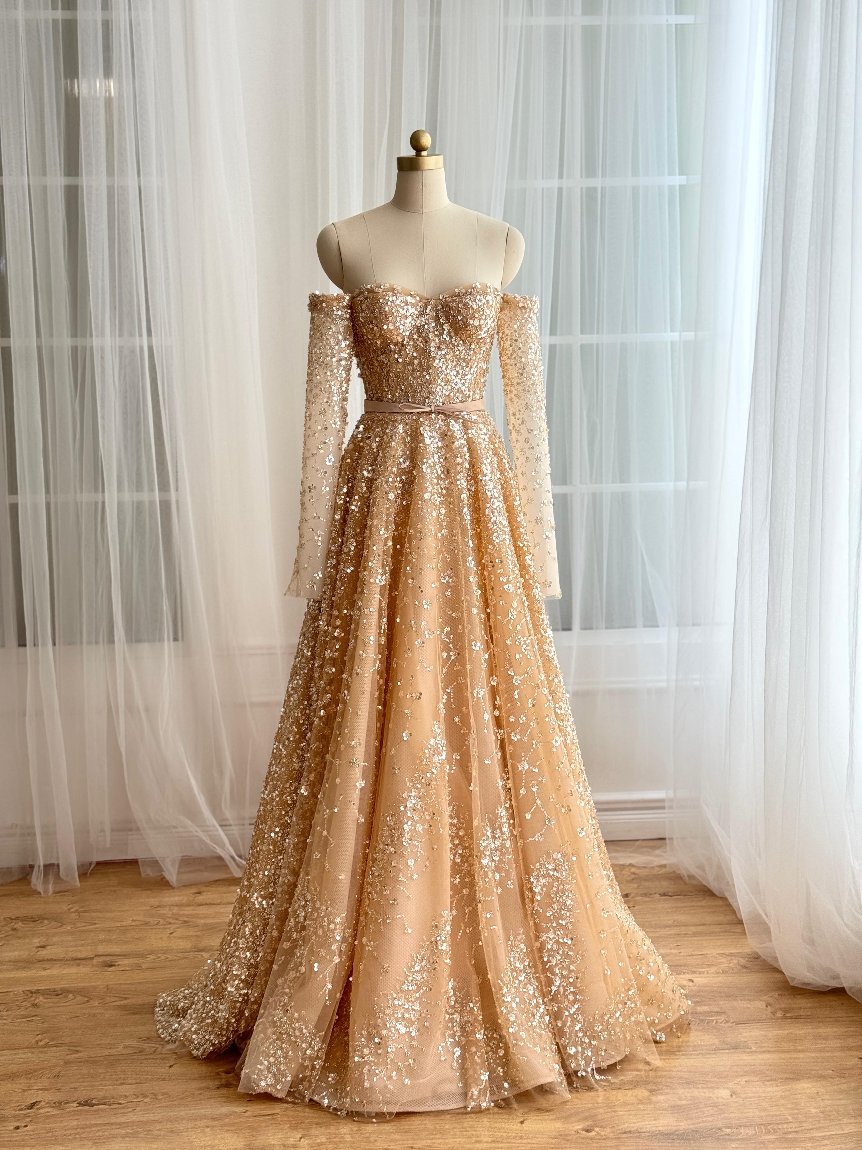 Beige A-Line dress with long off the shoulder sleeves and sequins