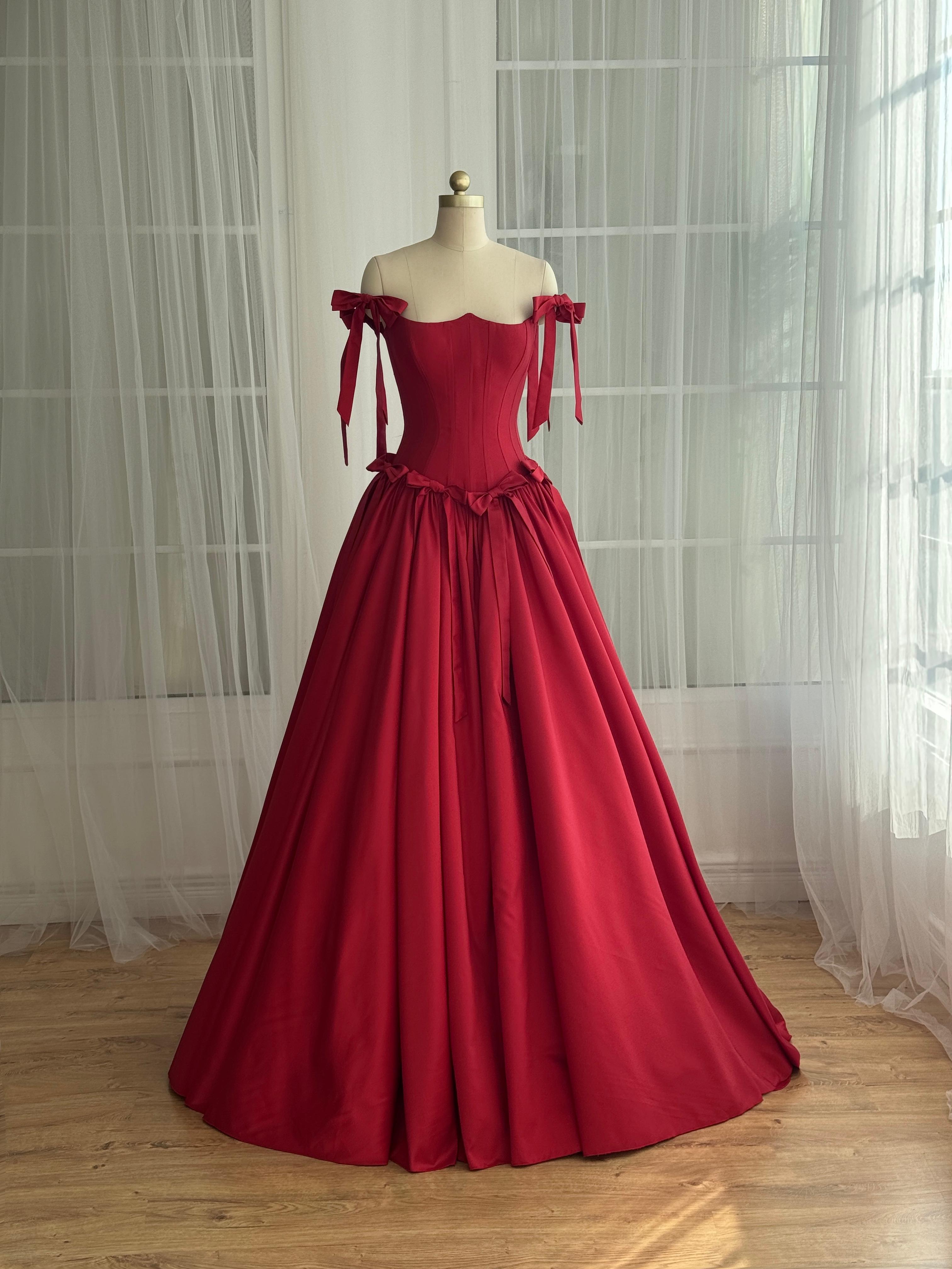 Red A-Line dress with off the shoulder sleeves and embroidered bows
