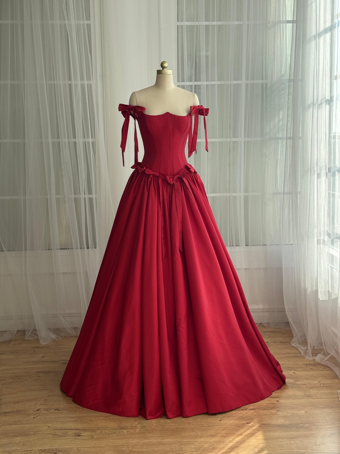 Red A-Line dress with off the shoulder sleeves and embroidered bows