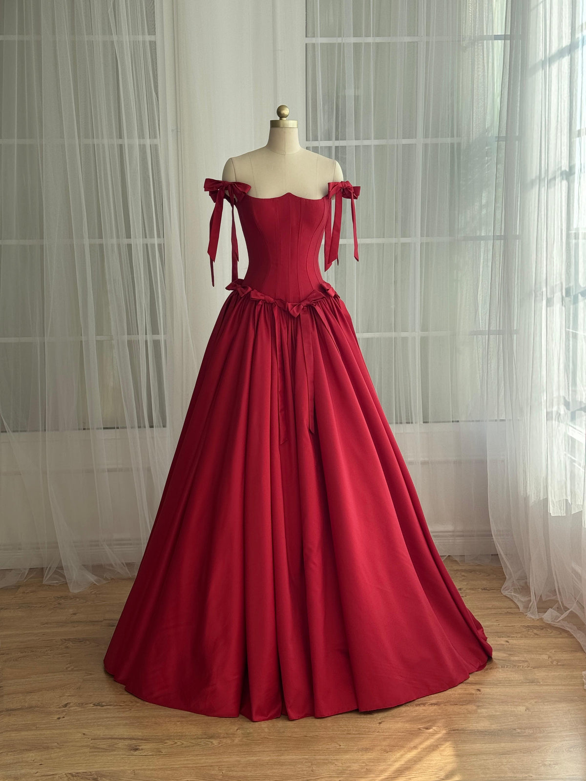 Red A-Line dress with off the shoulder sleeves and embroidered bows