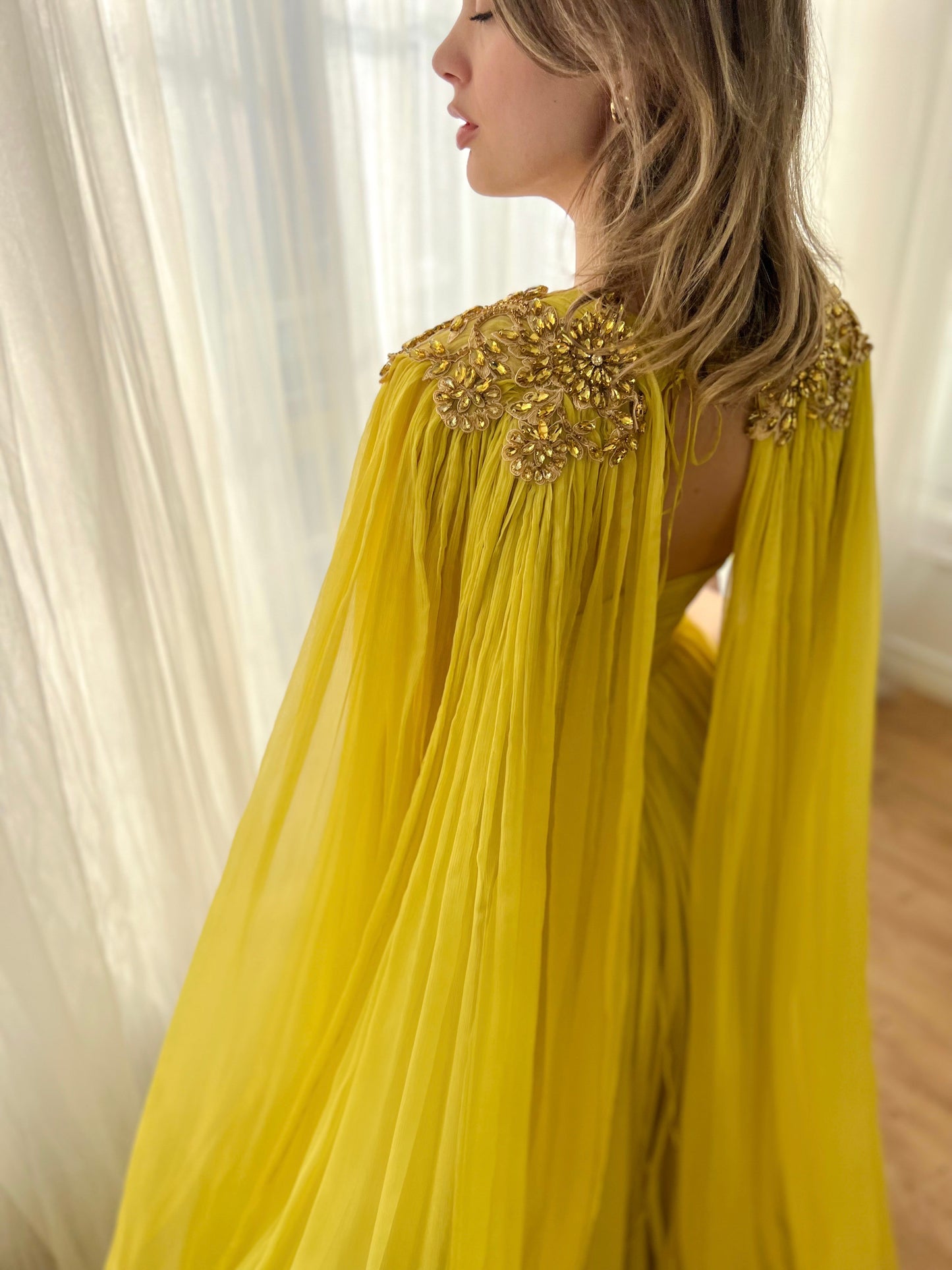 Yellow A-Line dress with embroidery and cape sleeves
