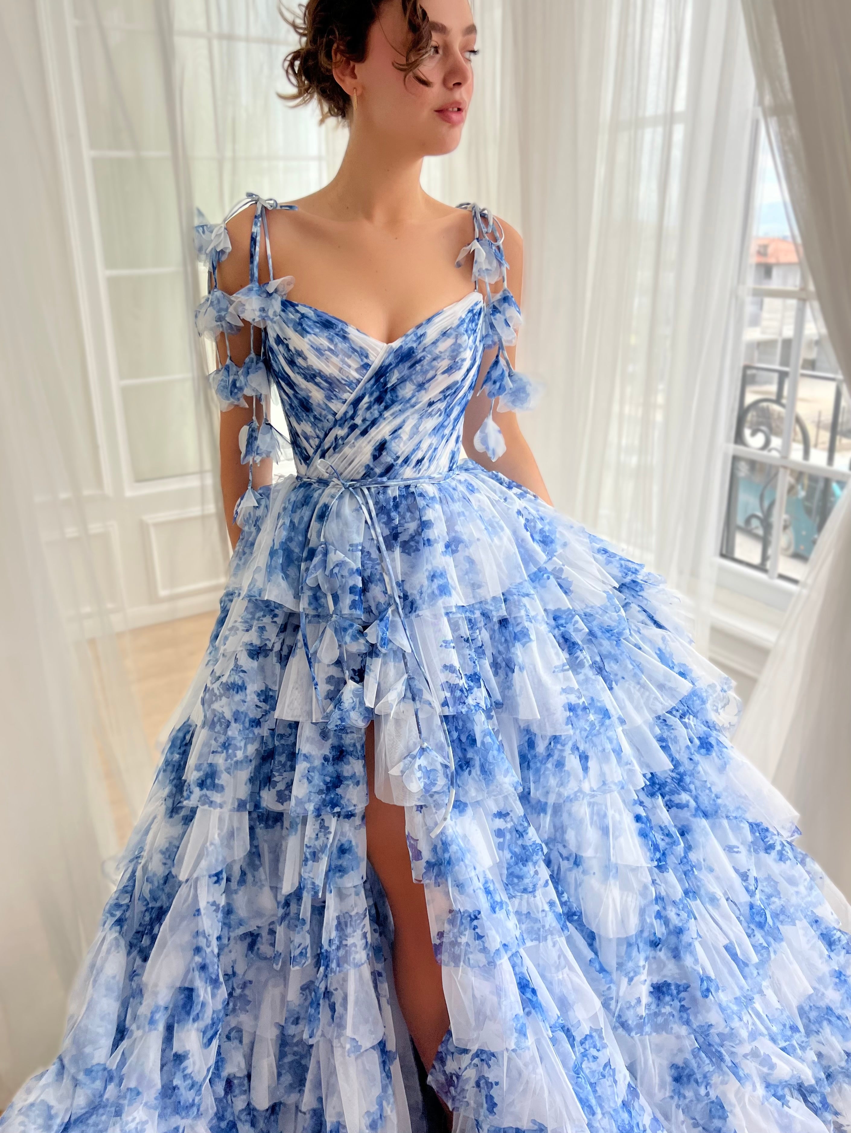 Blue A-Line dress with floral print, spaghetti straps and off the shoulder sleeves