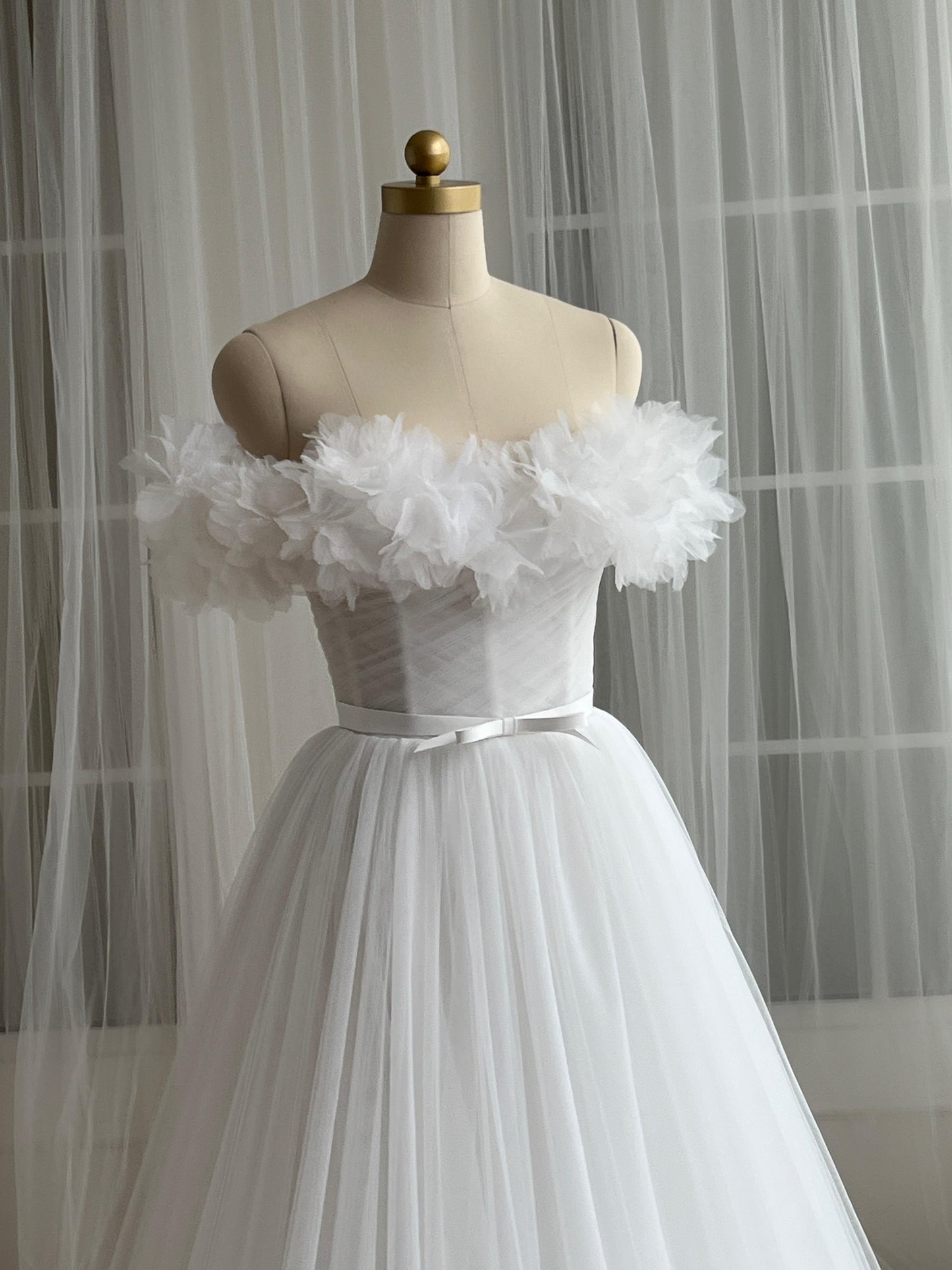 White bridql A-Line gown with embroidery, tulle and off the shoulder sleeves