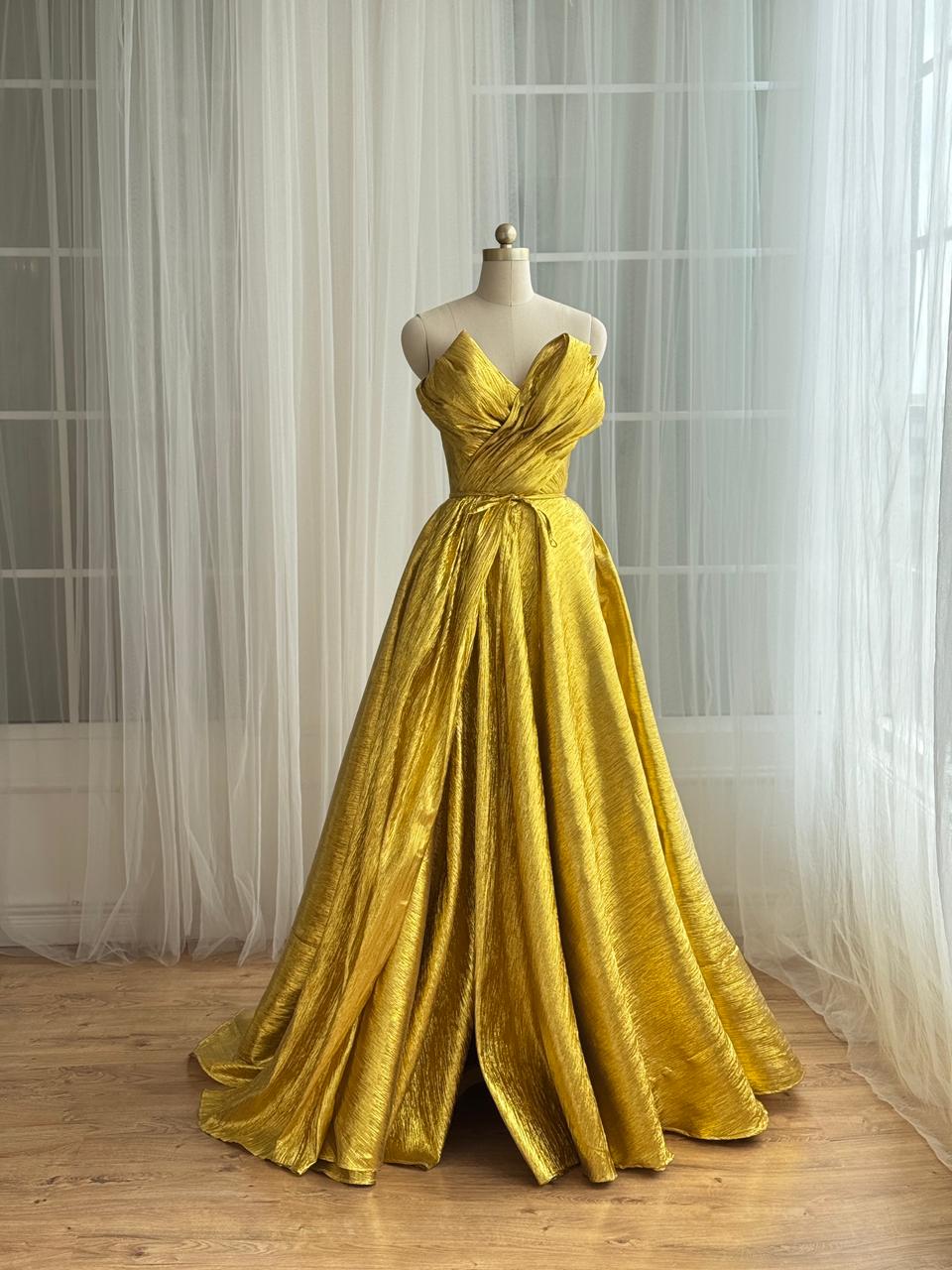 Yellow A-Line gown with no sleeves and v-neck