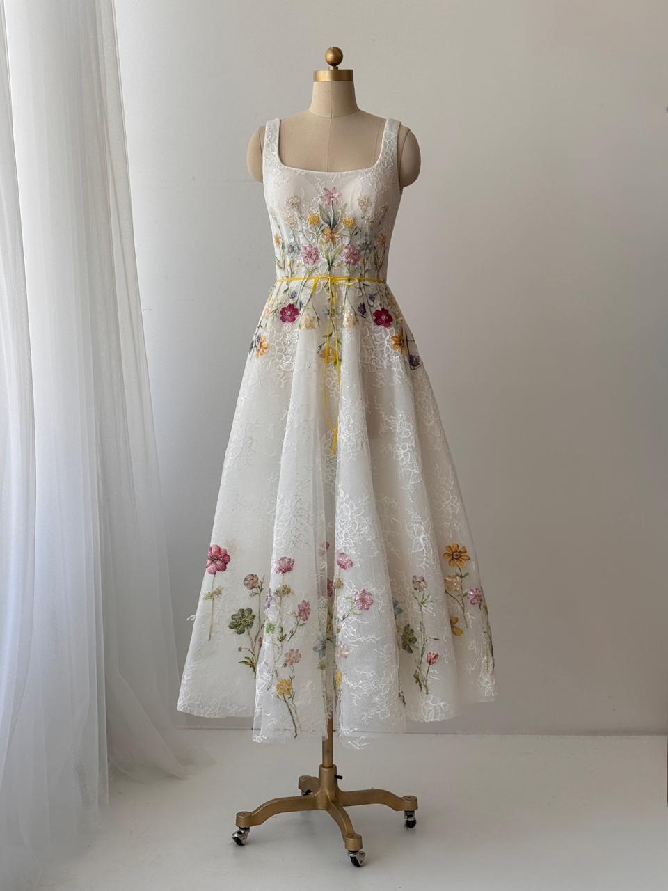White bridal midi dress with straps and floral embroidery
