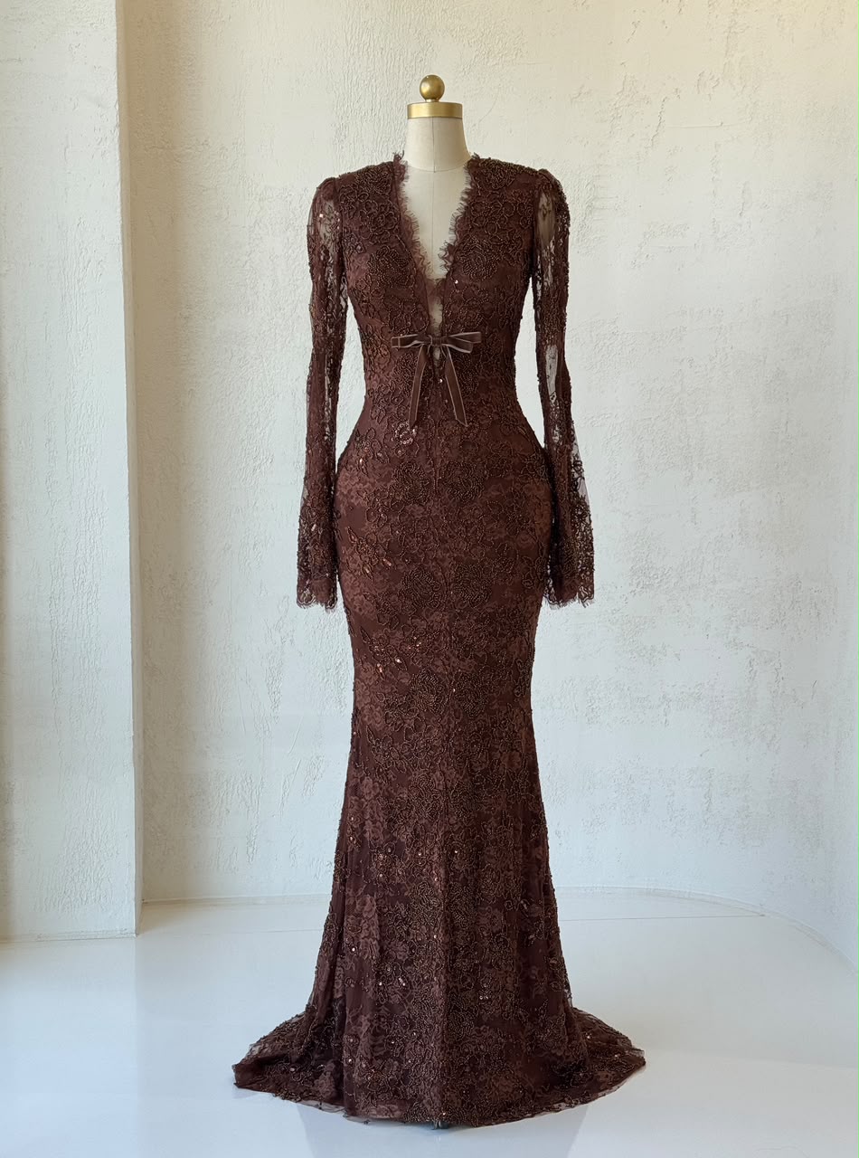 Brown mermaid gown with v-neck, long sleeves. lace and embroidery