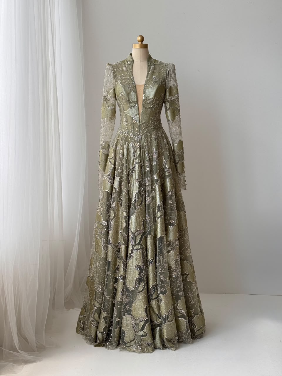 Green A-Line gown with long sleeves, sequins and v-neck