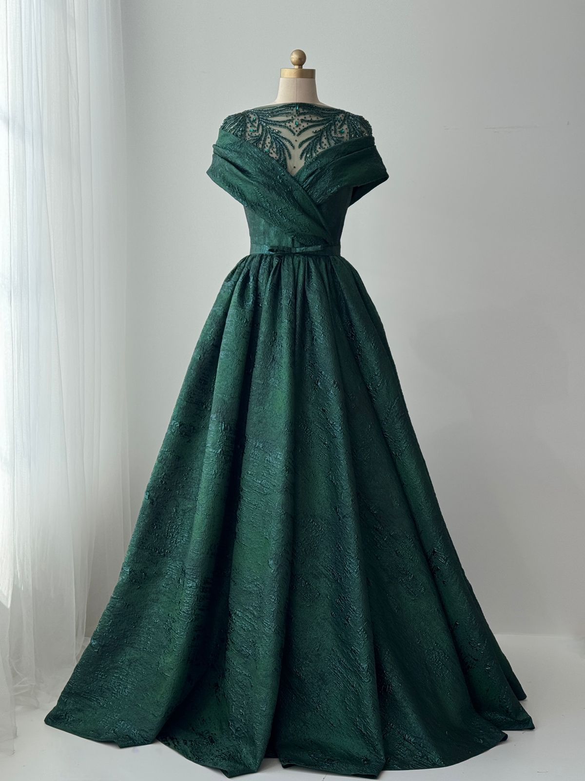 Green A-Line gown with shawl, short sleeves and brocade fabric