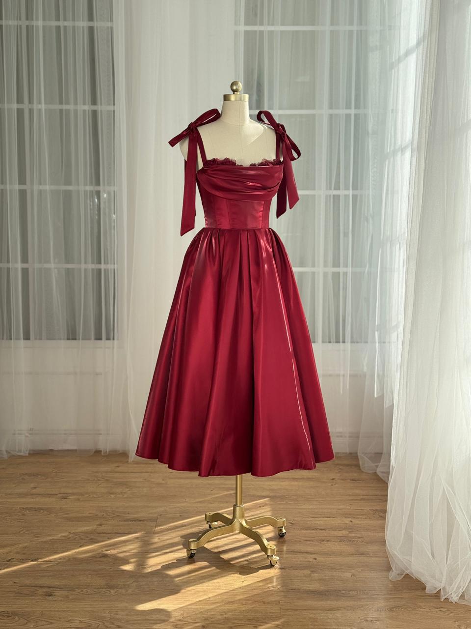 Red midi dress with bow straps and floral trim