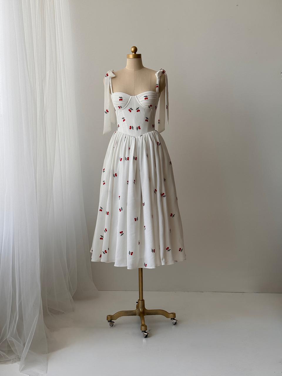 White midi dress with bow straps and cherries