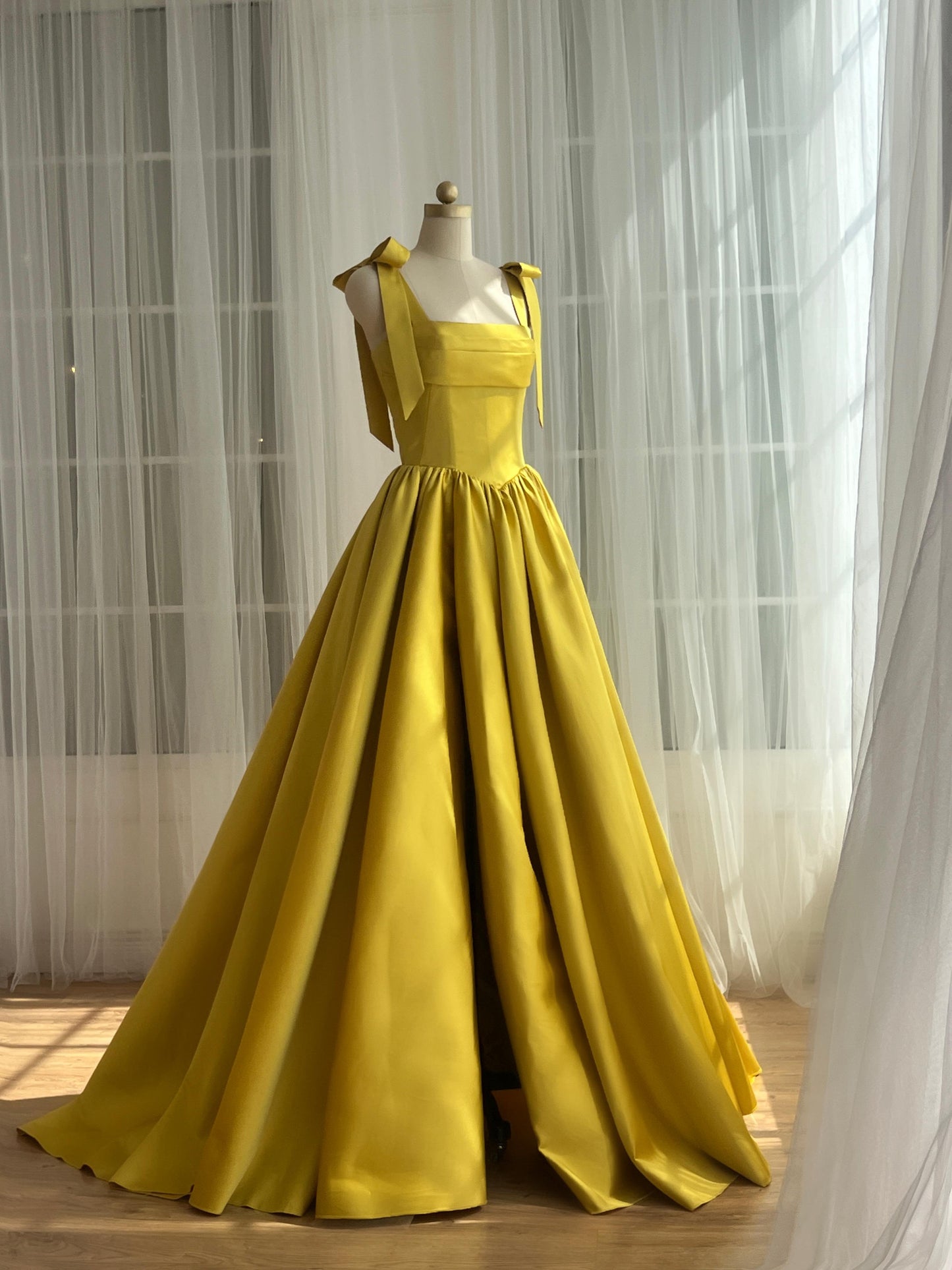 Yellow A-Line dress with bow straps and taffeta fabric