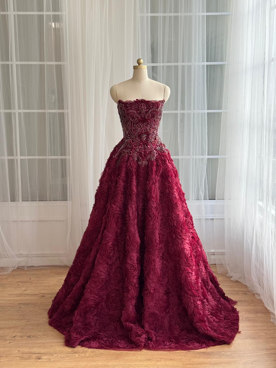 Burgundy A-Line gown with ruffled skirt, embroidery and no sleeves