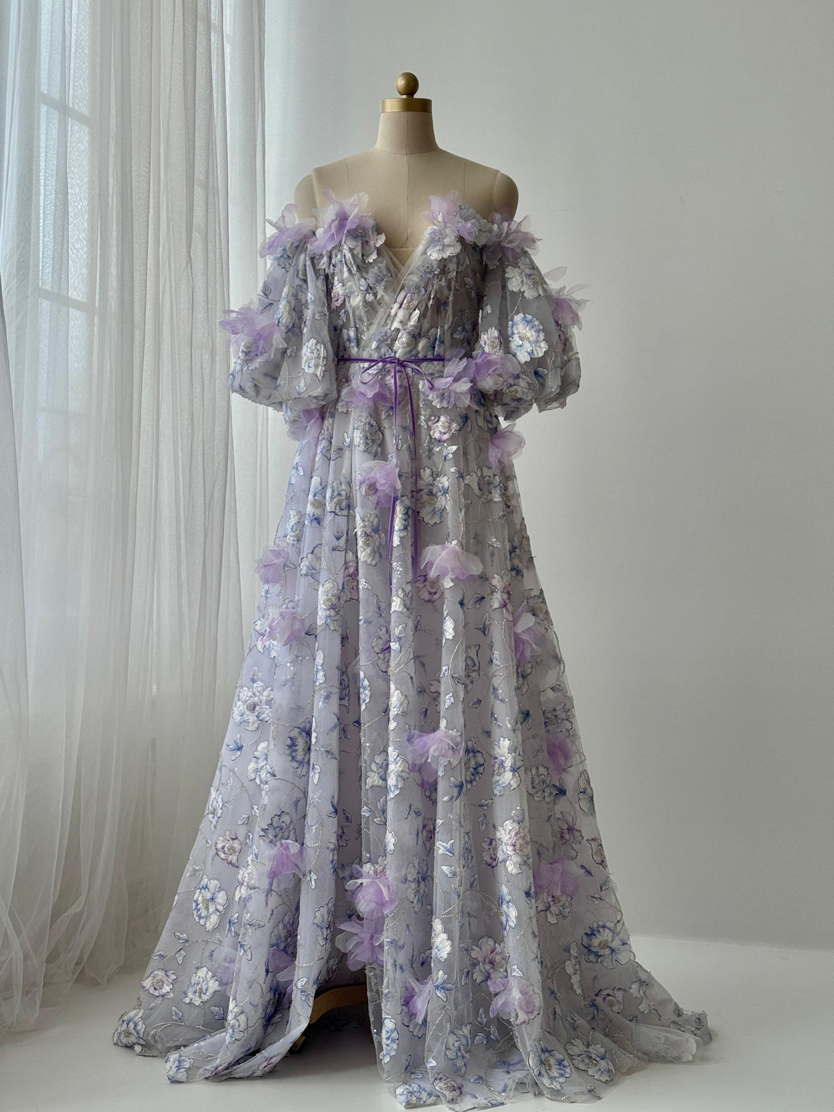 Purple A-Line gown with short off the shoulder sleeves, embroidery and v-neck