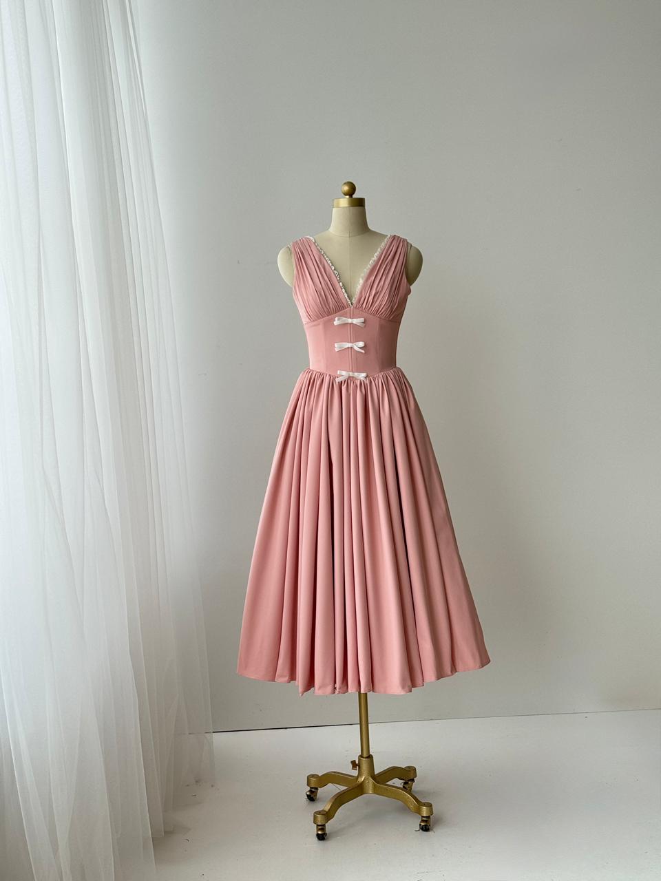Pink midi dress with embroidered bows, lace and no sleeves