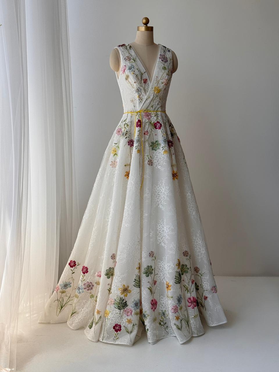 White bridal A-Line gown with floral embroidery, v-neck and no sleeves