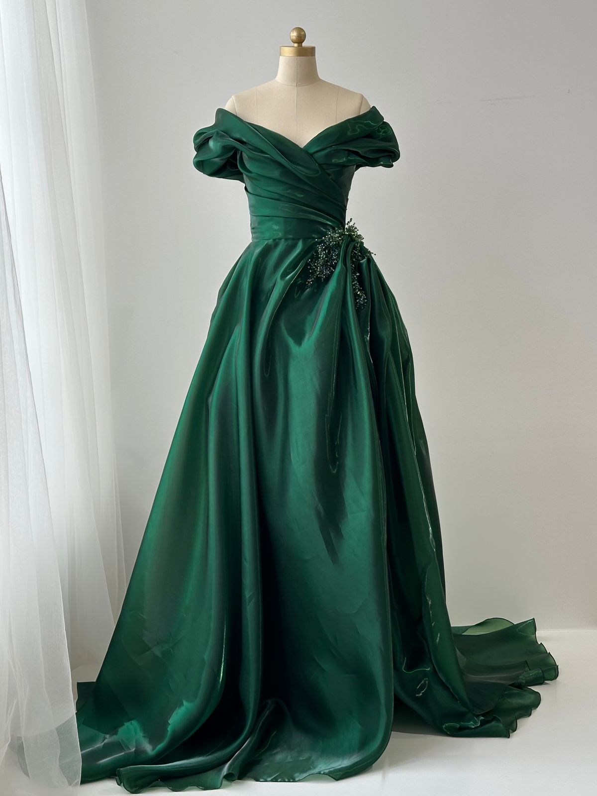 Green A-Line dress with off the shoulder sleeves, taffeta fabric and embroidery