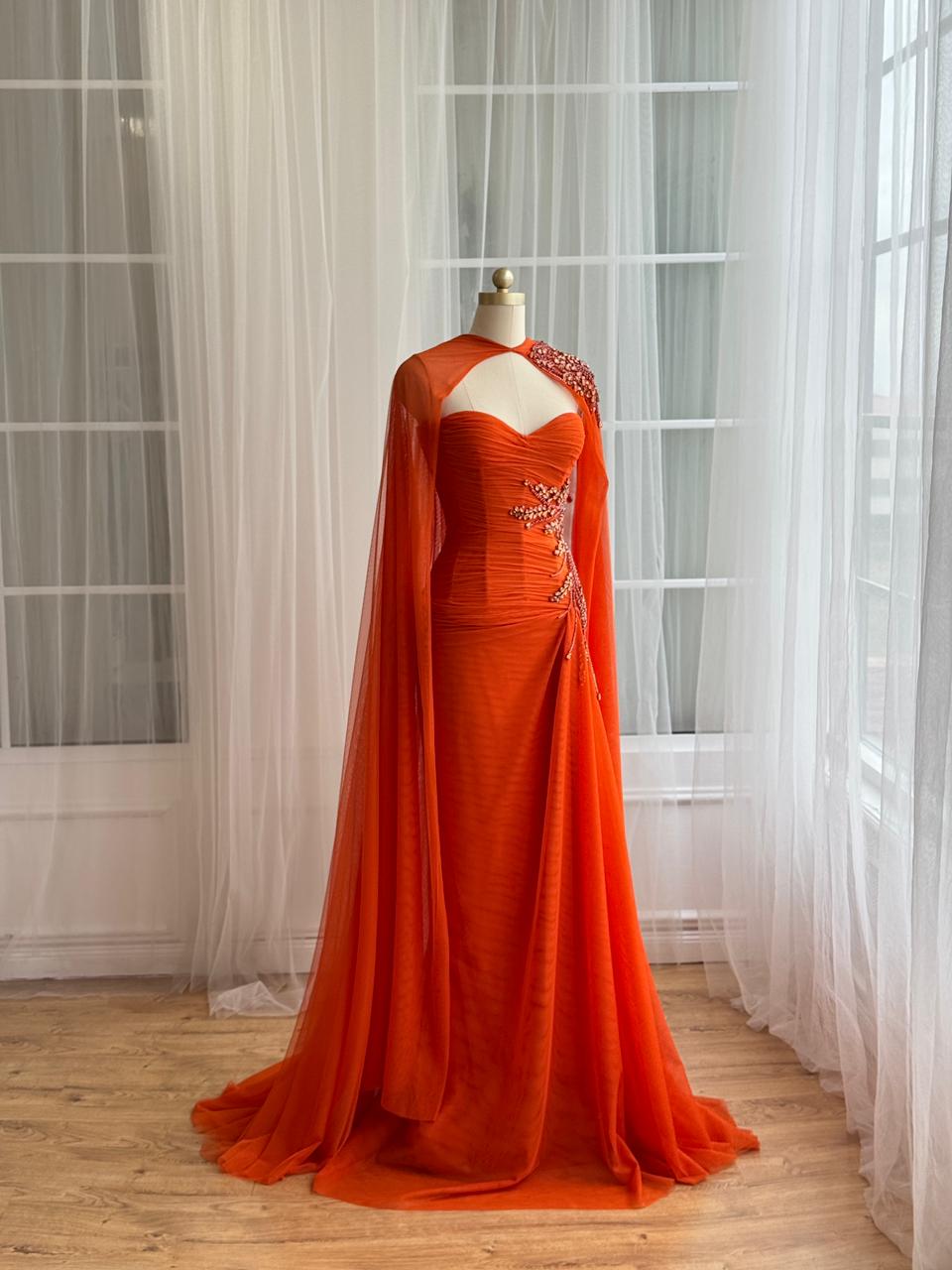 Orange mermaid dress with embroidery, cape and no sleeves