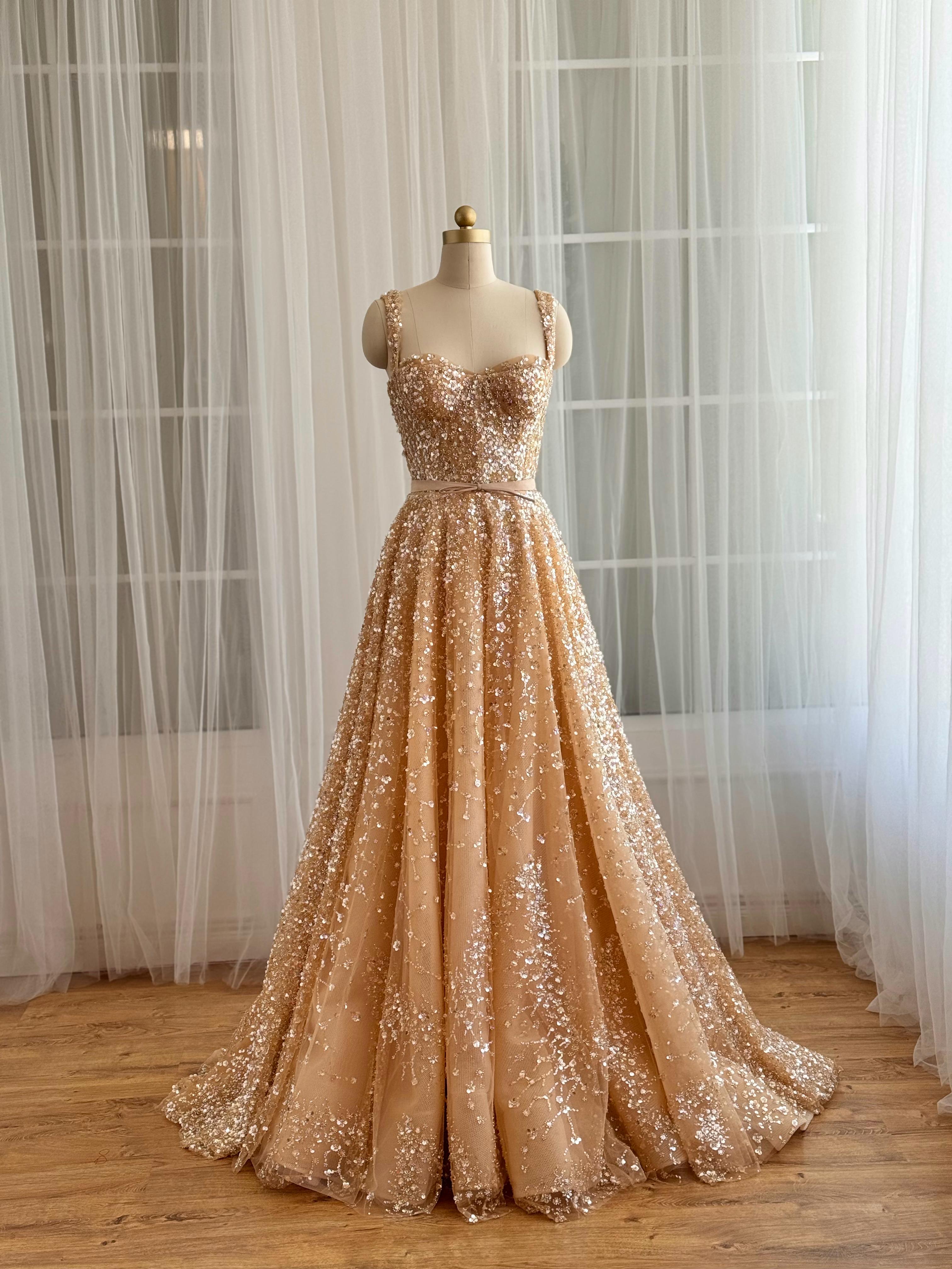 Beige A-Line gown with straps and gold sequins