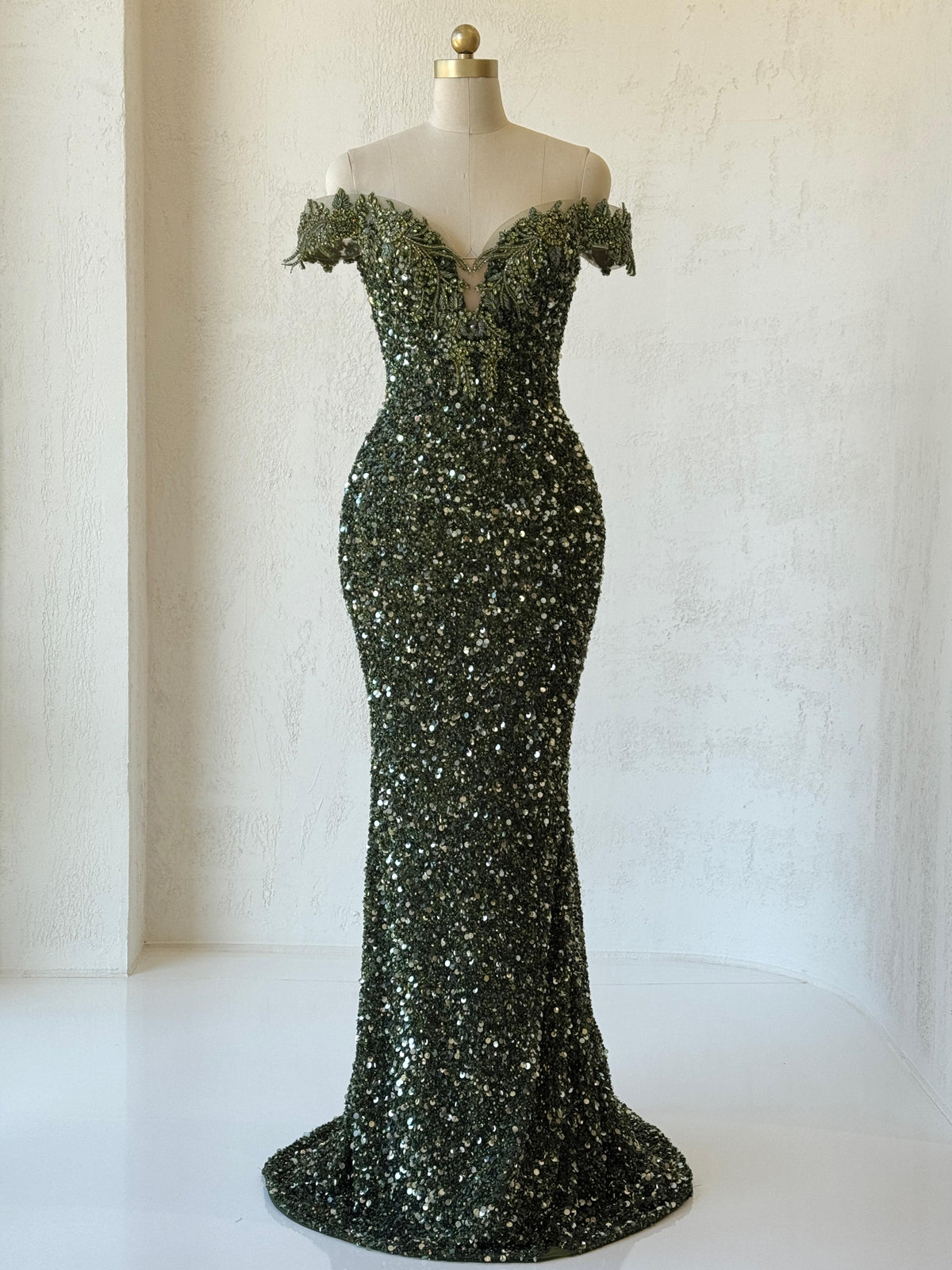 Green mermaid gown with off the shoulder sleeves, v-neck, embroidery and sequins