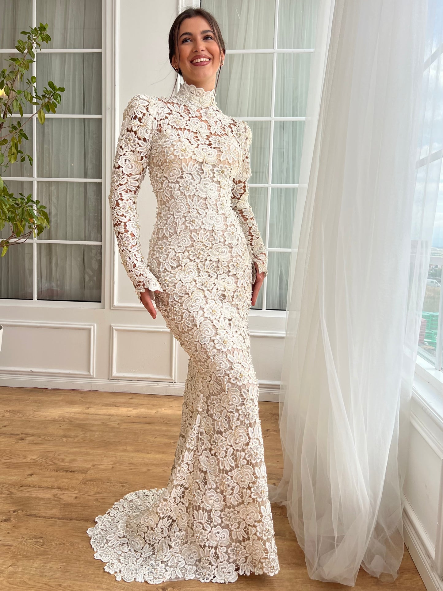 White bridal mermaid dress with long sleeves and lace