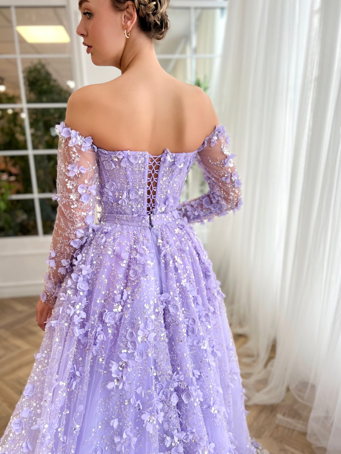 Purple overskirt dress with long off the shoulder sleeves and embroidered flowers