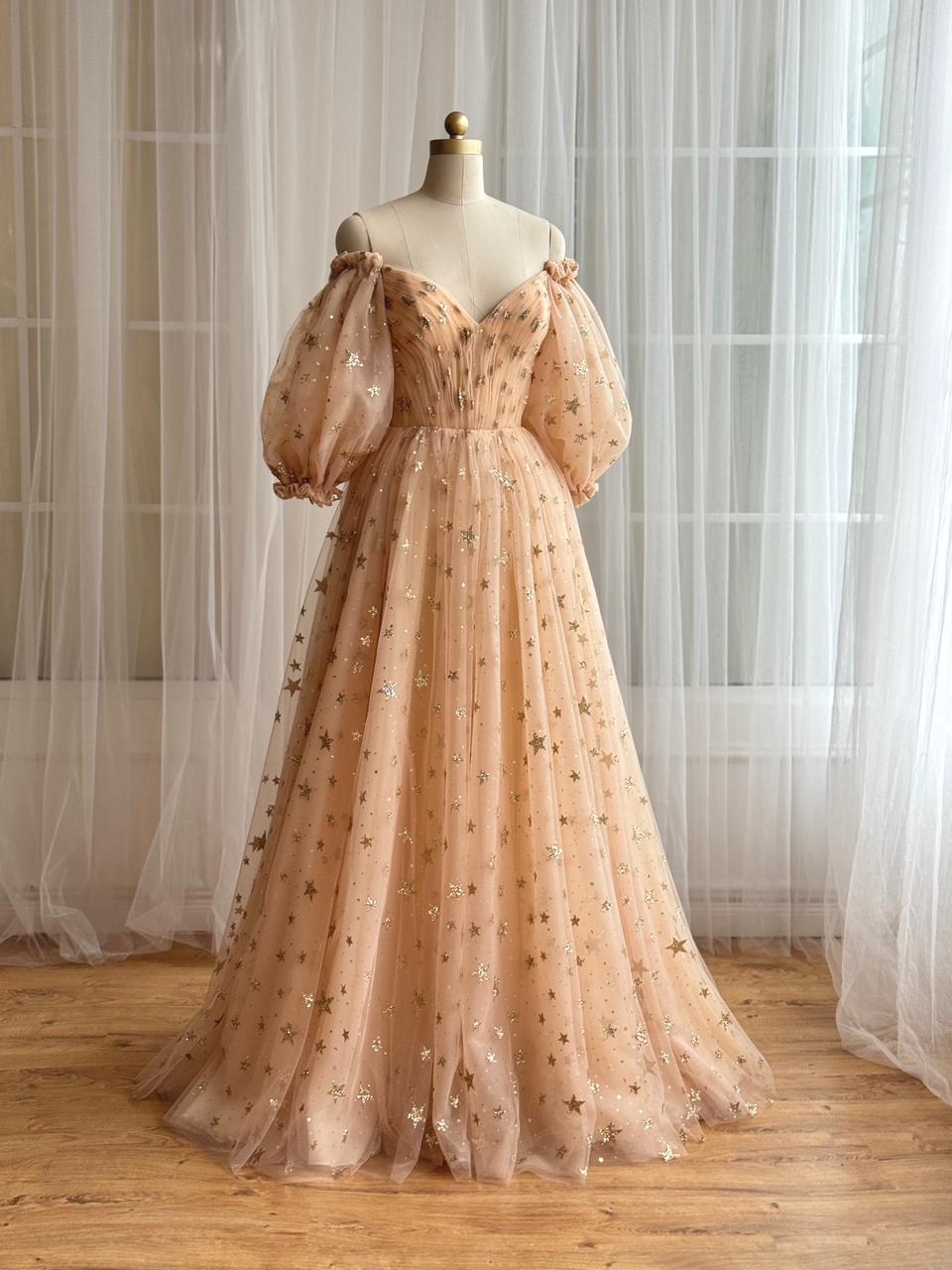 Gold A-Line dress with long off the shoulder sleeves, v-neck and starry tulle fabric