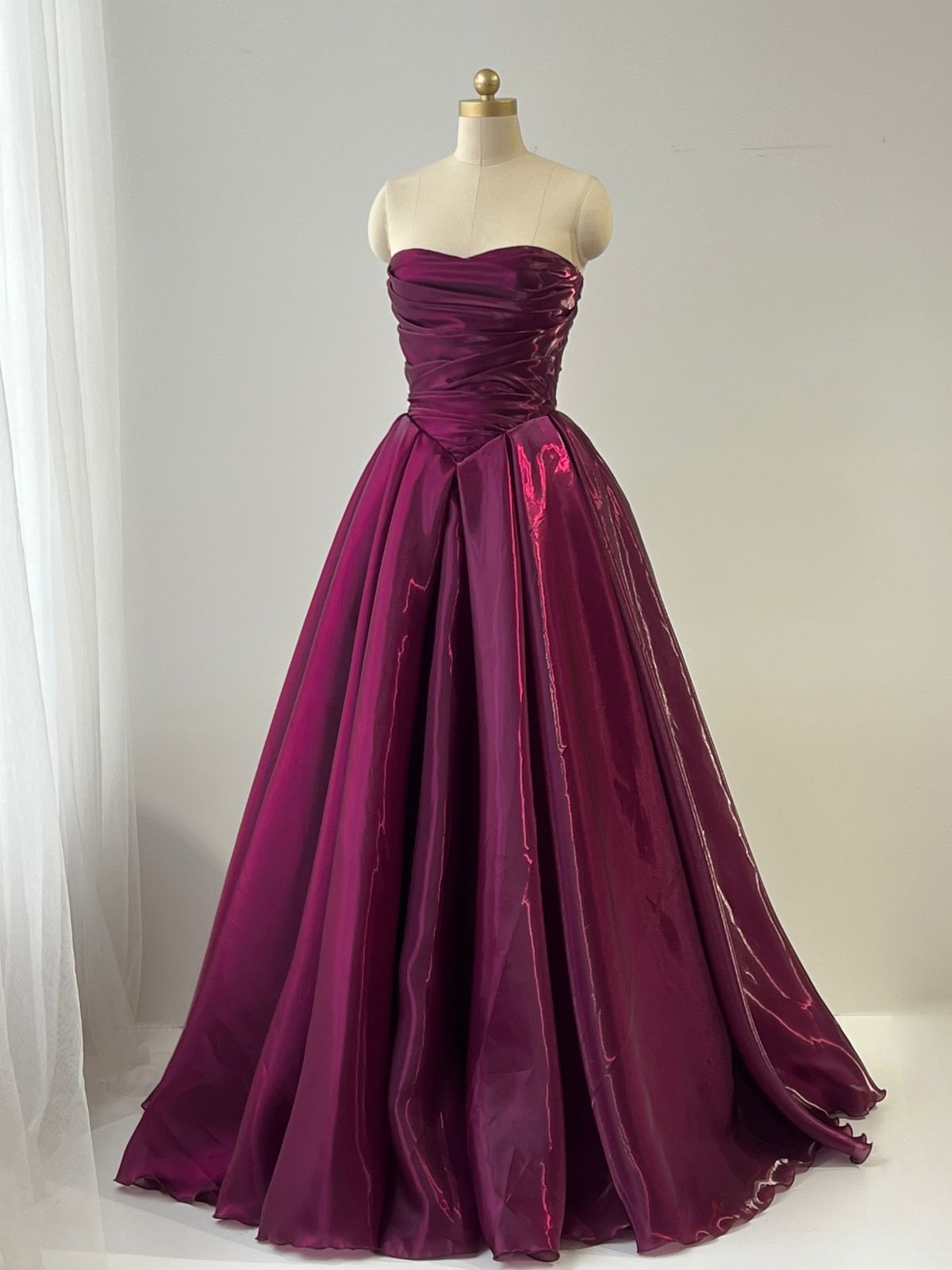 Red A-Line gown with taffeta fabric and no sleeves