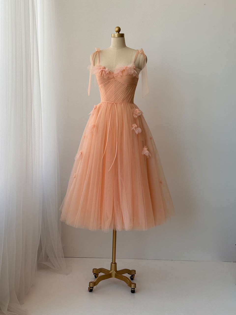 Peach midi dress with bow straps and embroidered flowers