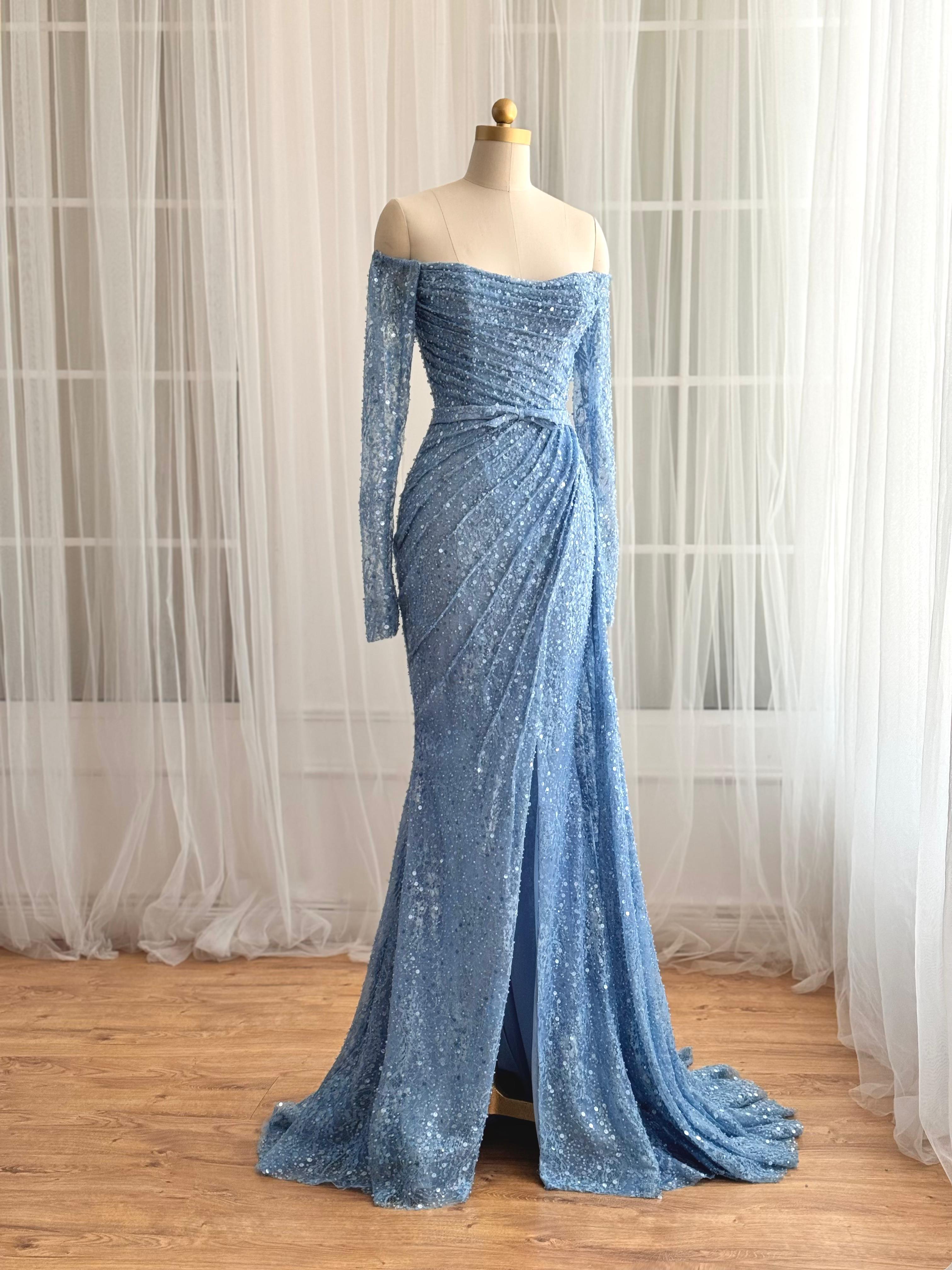 Blue mermaid dress with long off the shoulder sleeves and sequin fabric