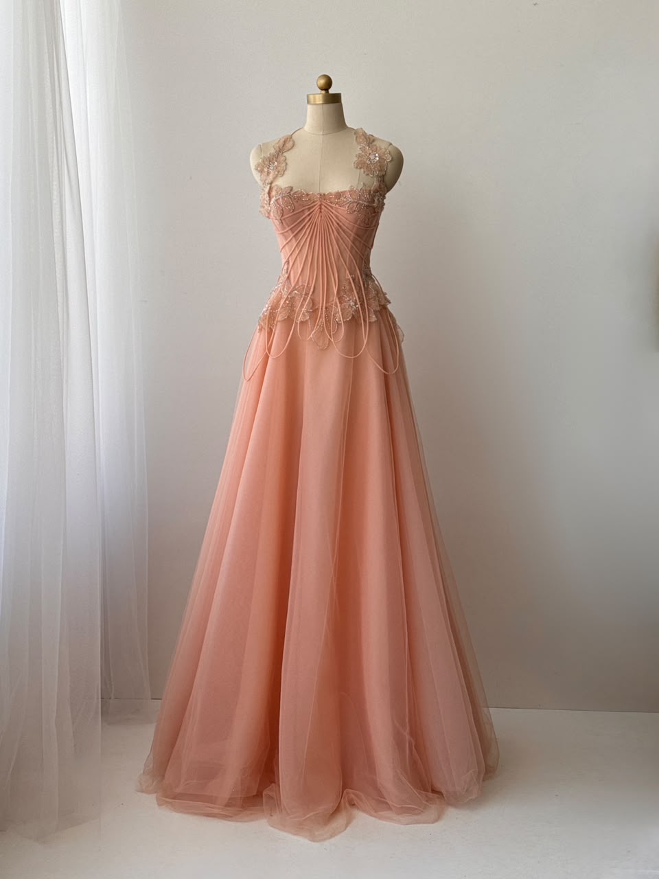 Peach A-Line gown with straps and embroidery