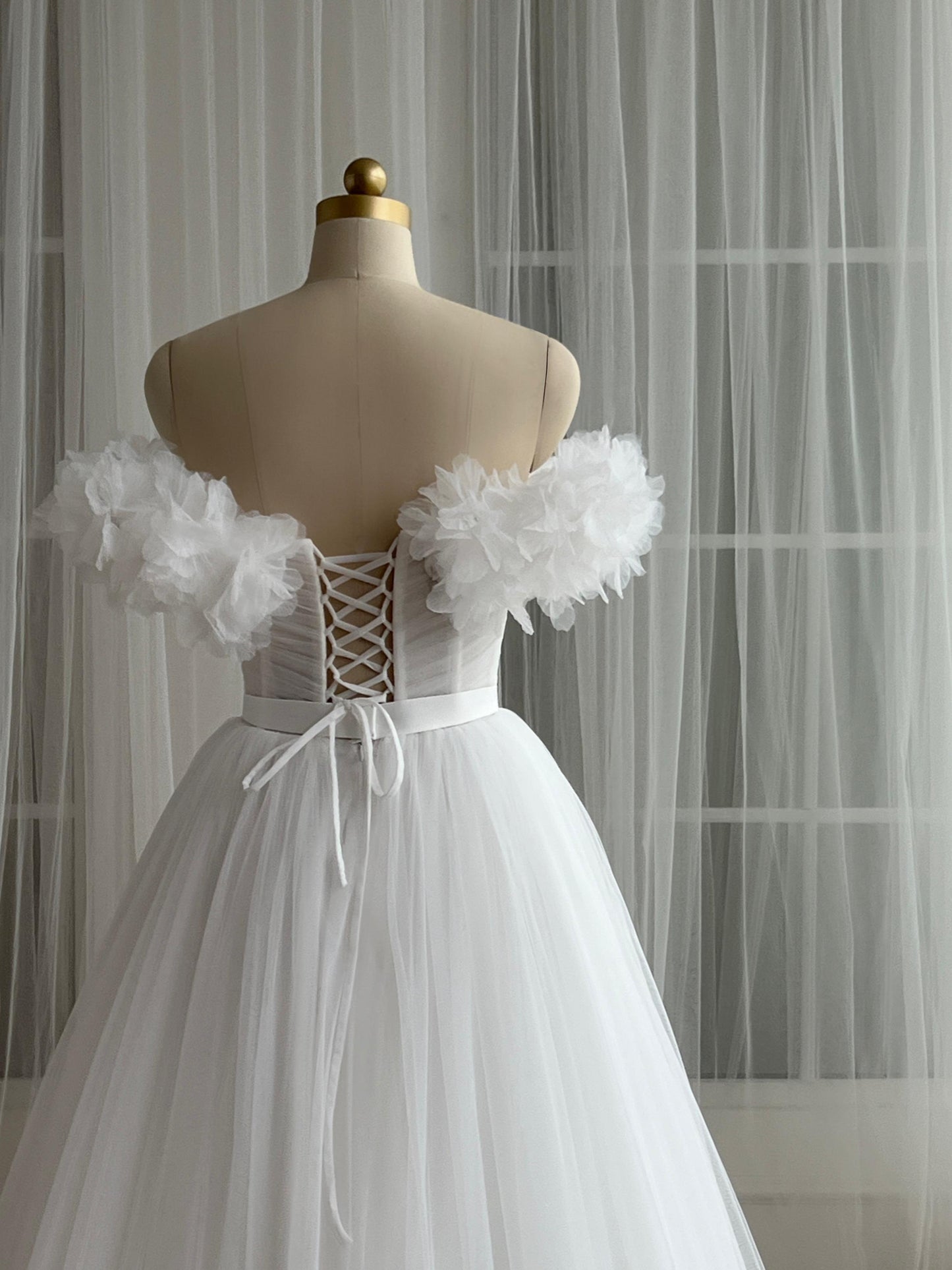 White bridql A-Line gown with embroidery, tulle and off the shoulder sleeves
