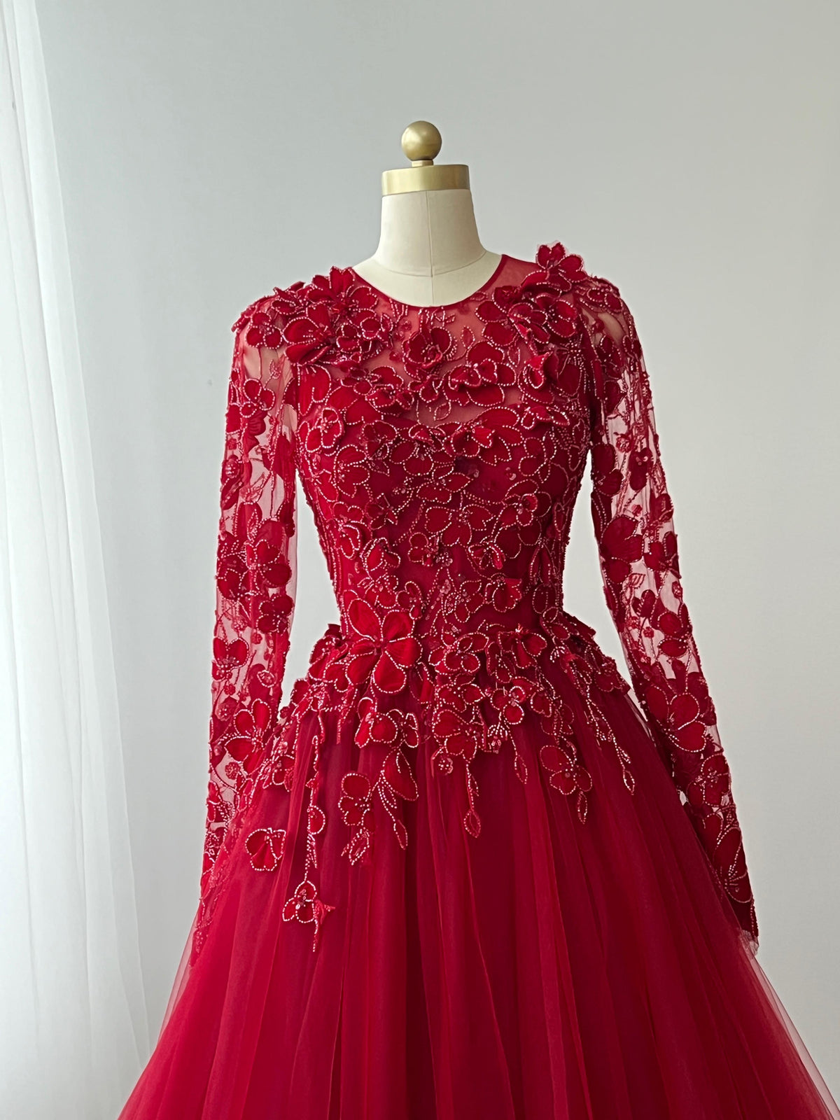 Red A-Line gown with long sleeves, lace and embroidery