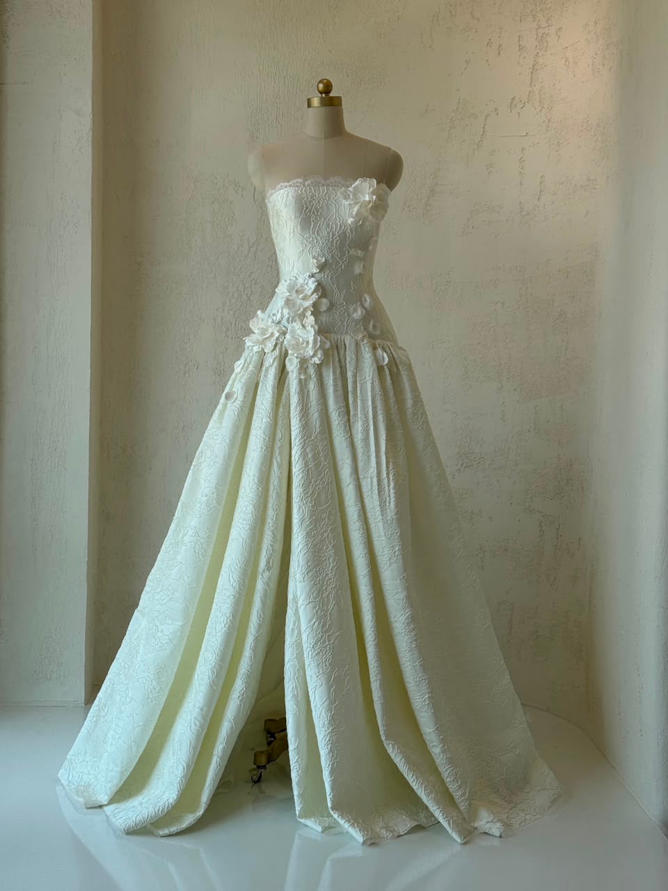 White A-Line gown with embroidery and no sleeves