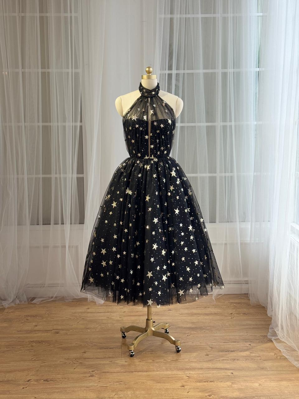 Black midi dress with starry fabric and no sleeves