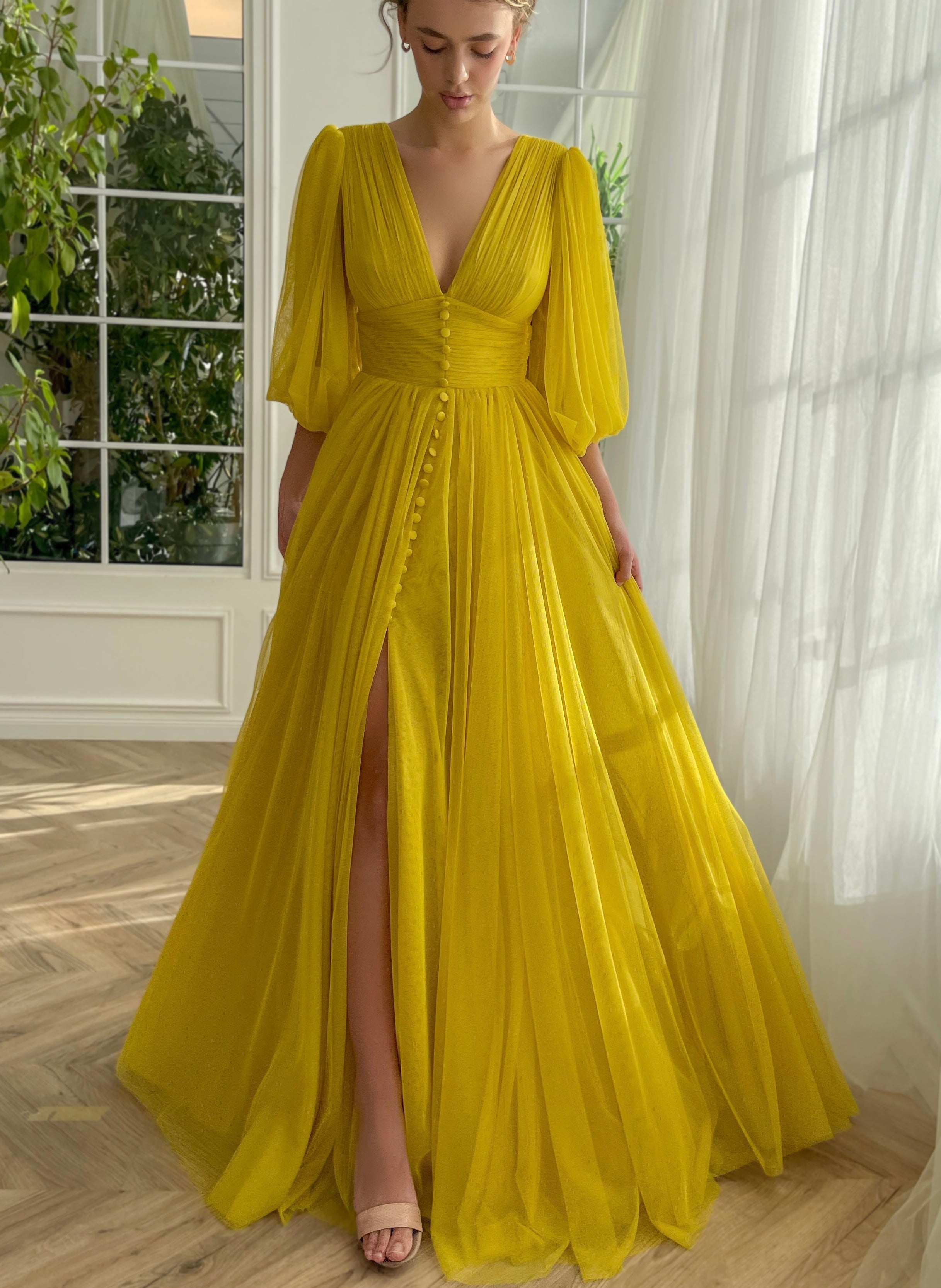 Yellow A-Line dress with long sleeves and v-neck