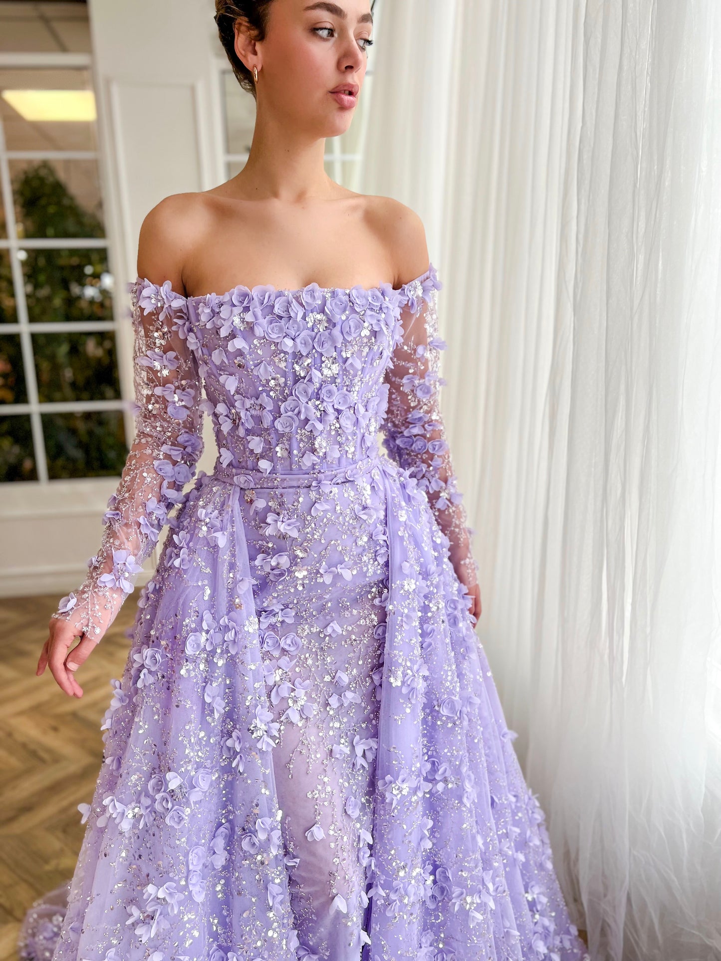 Purple overskirt dress with long off the shoulder sleeves and embroidered flowers