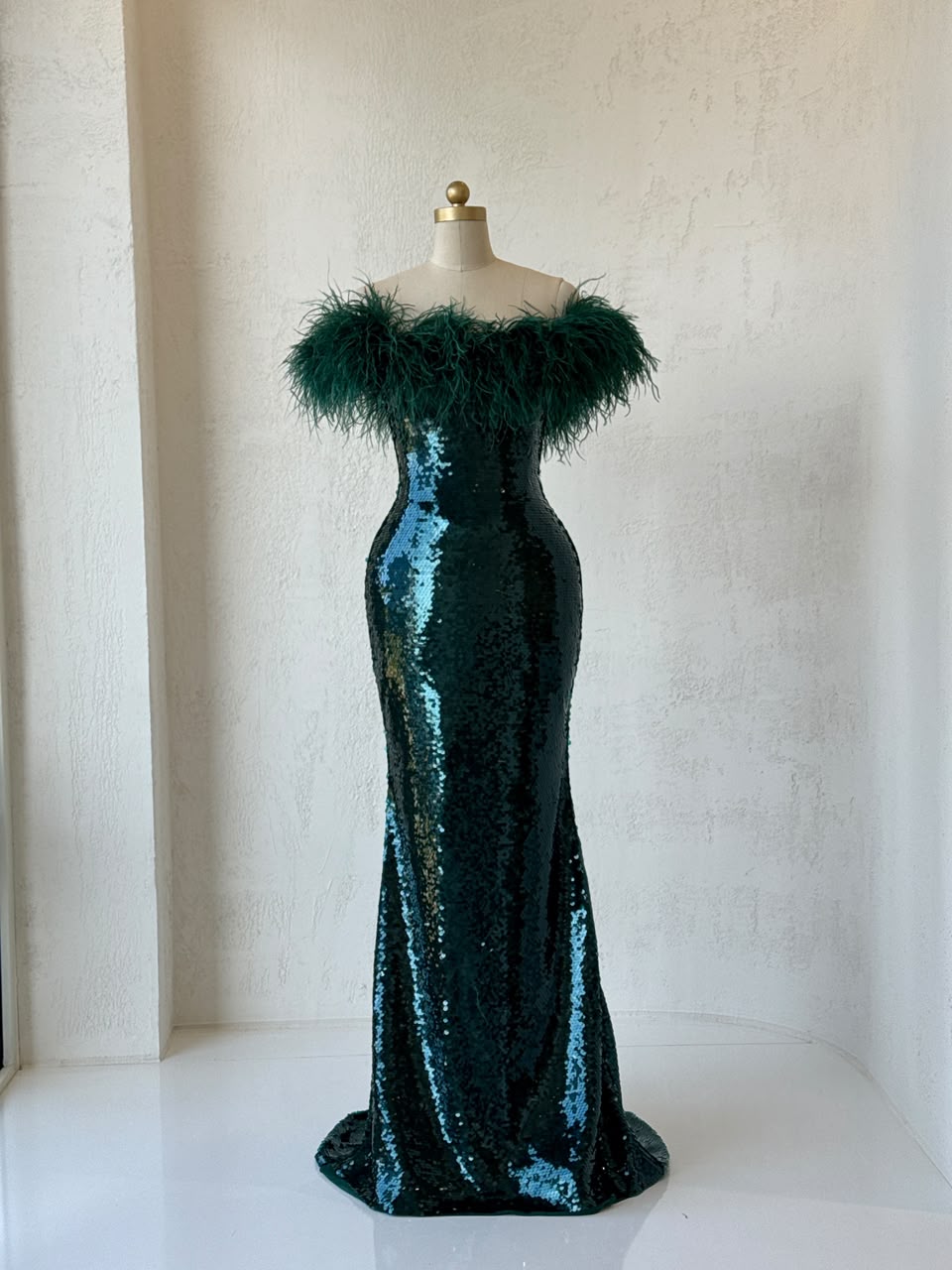 Green mermaid gown with sequins, embroidery, feathers and off the shoulder sleeves