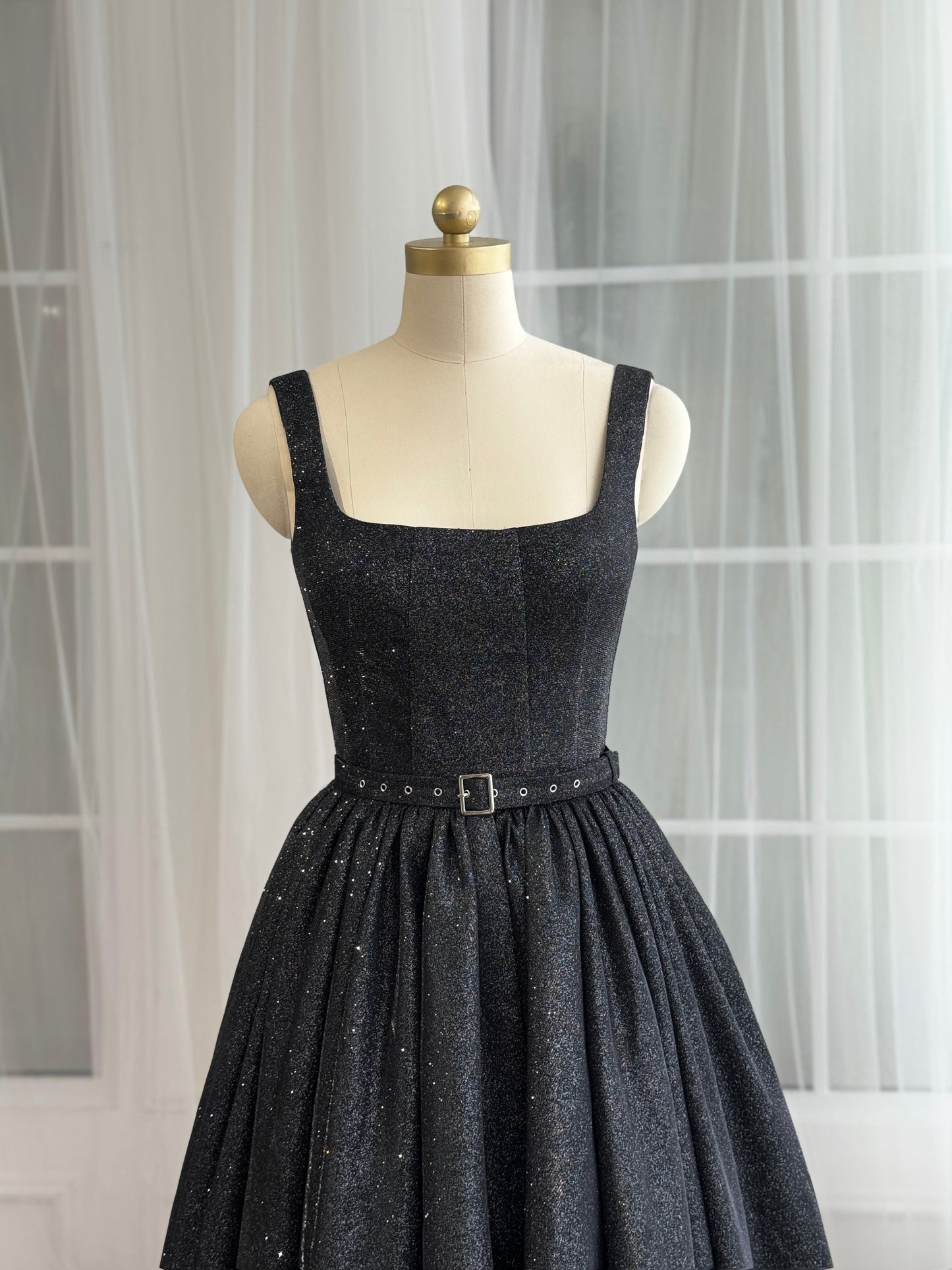Black midi dress with straps, belt and sparkly fabric