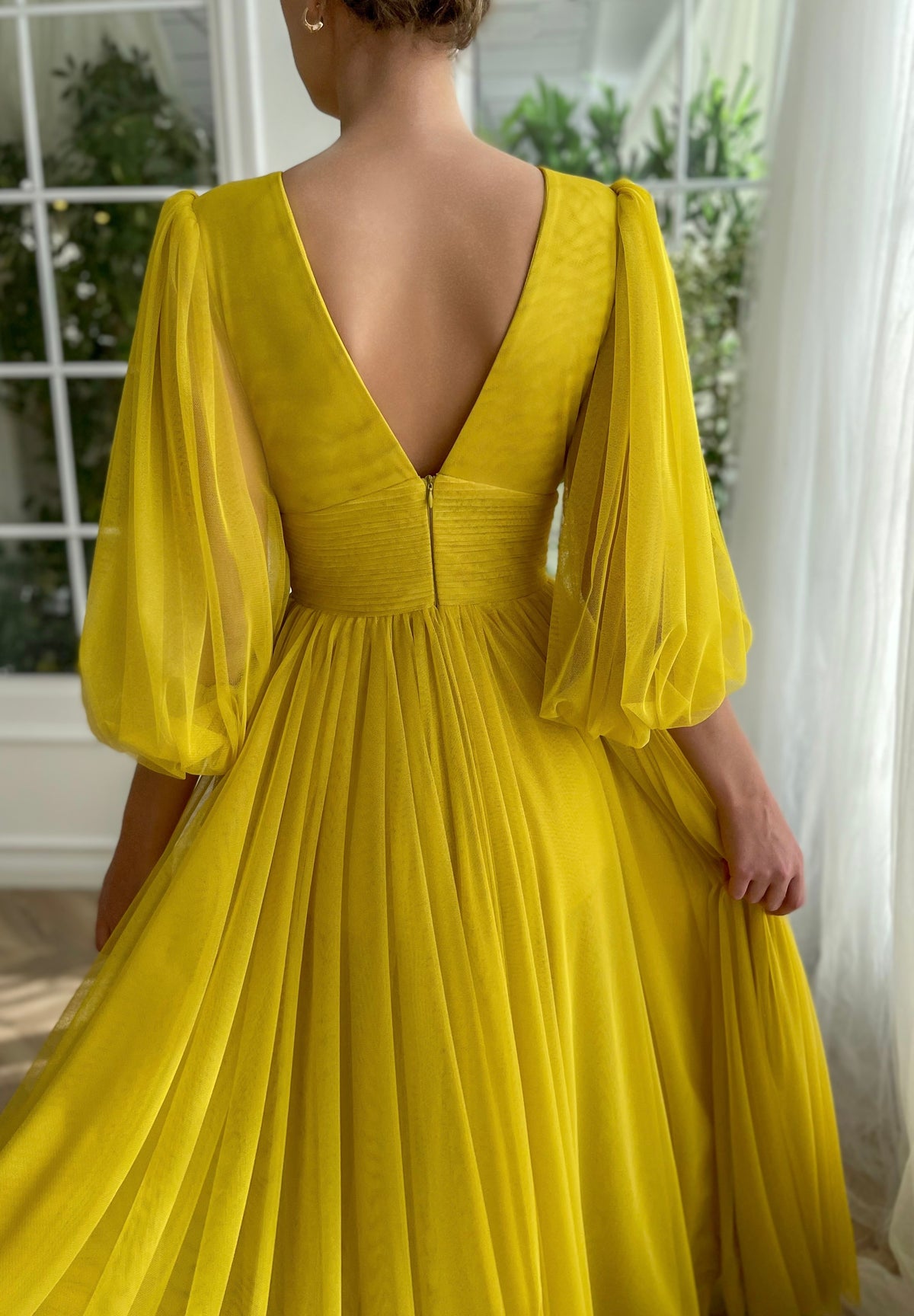 Yellow A-Line dress with long sleeves and v-neck