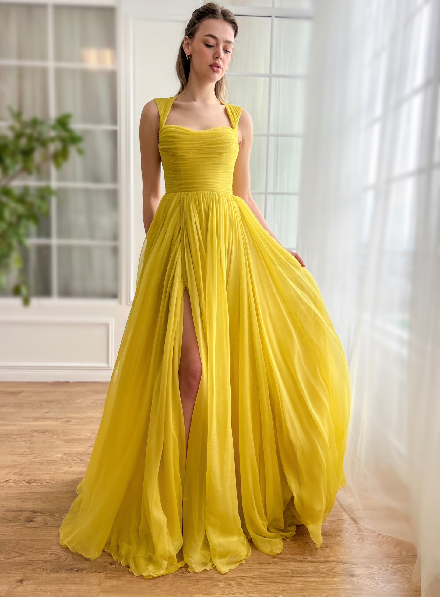 Yellow A-Line dress with embroidery and cape sleeves