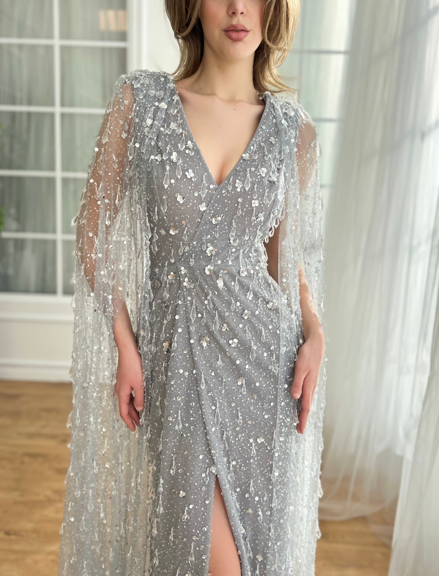 Grey mermaid dress with v-neck, cape and embroidered crystals