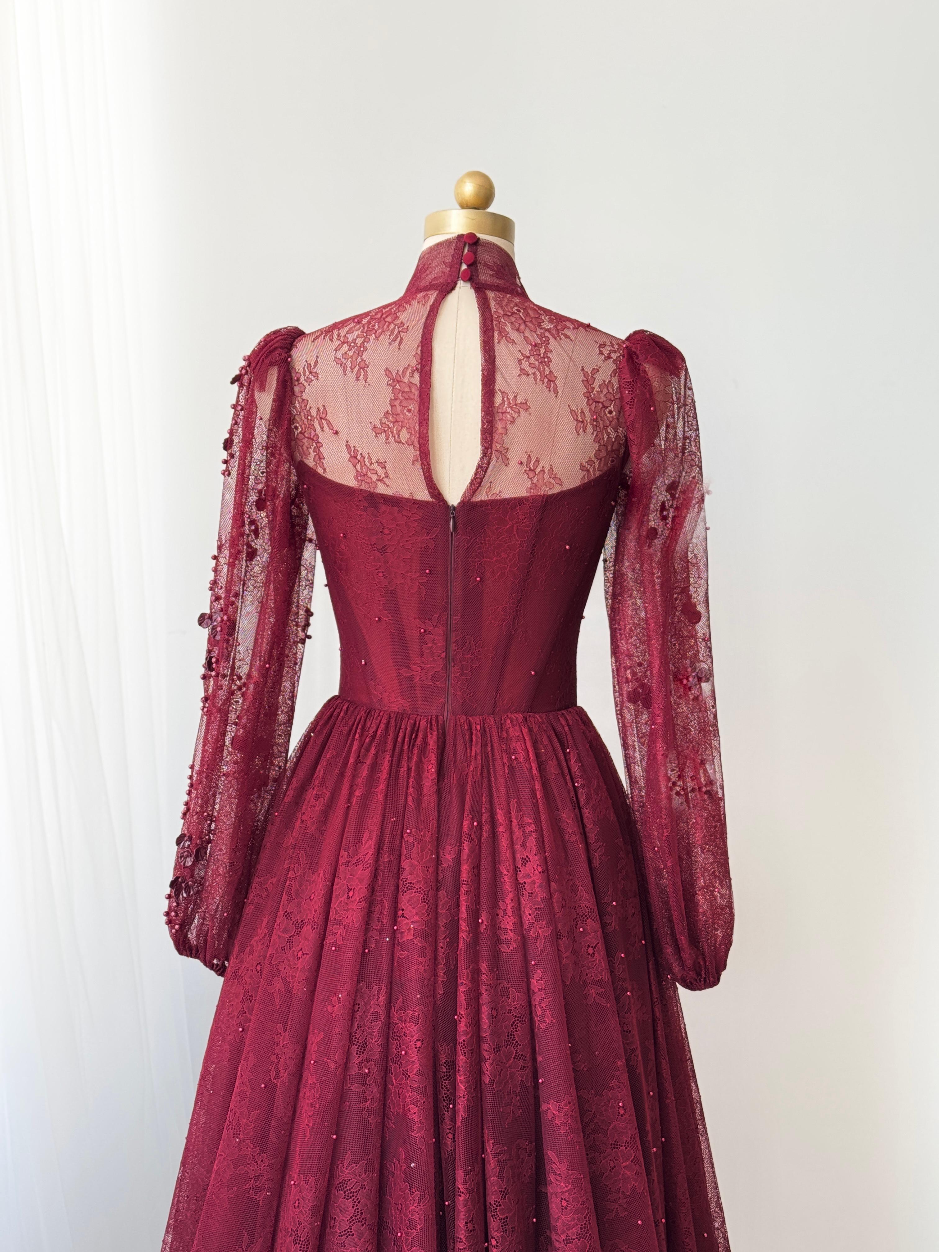 Burgundy A-Line gown with long sleeves and embroidered work