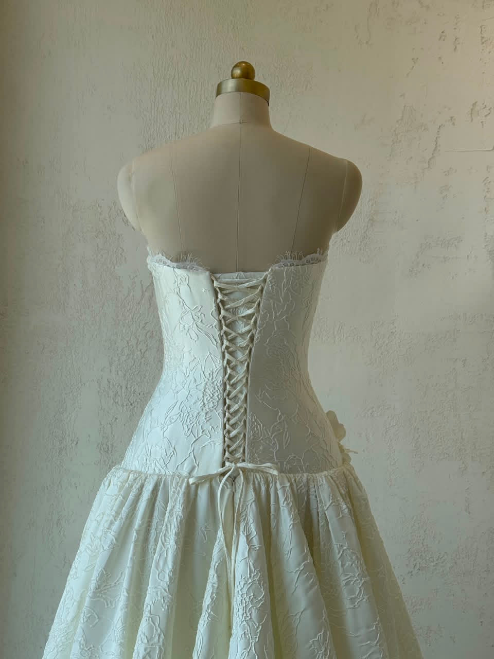 White A-Line gown with embroidery and no sleeves