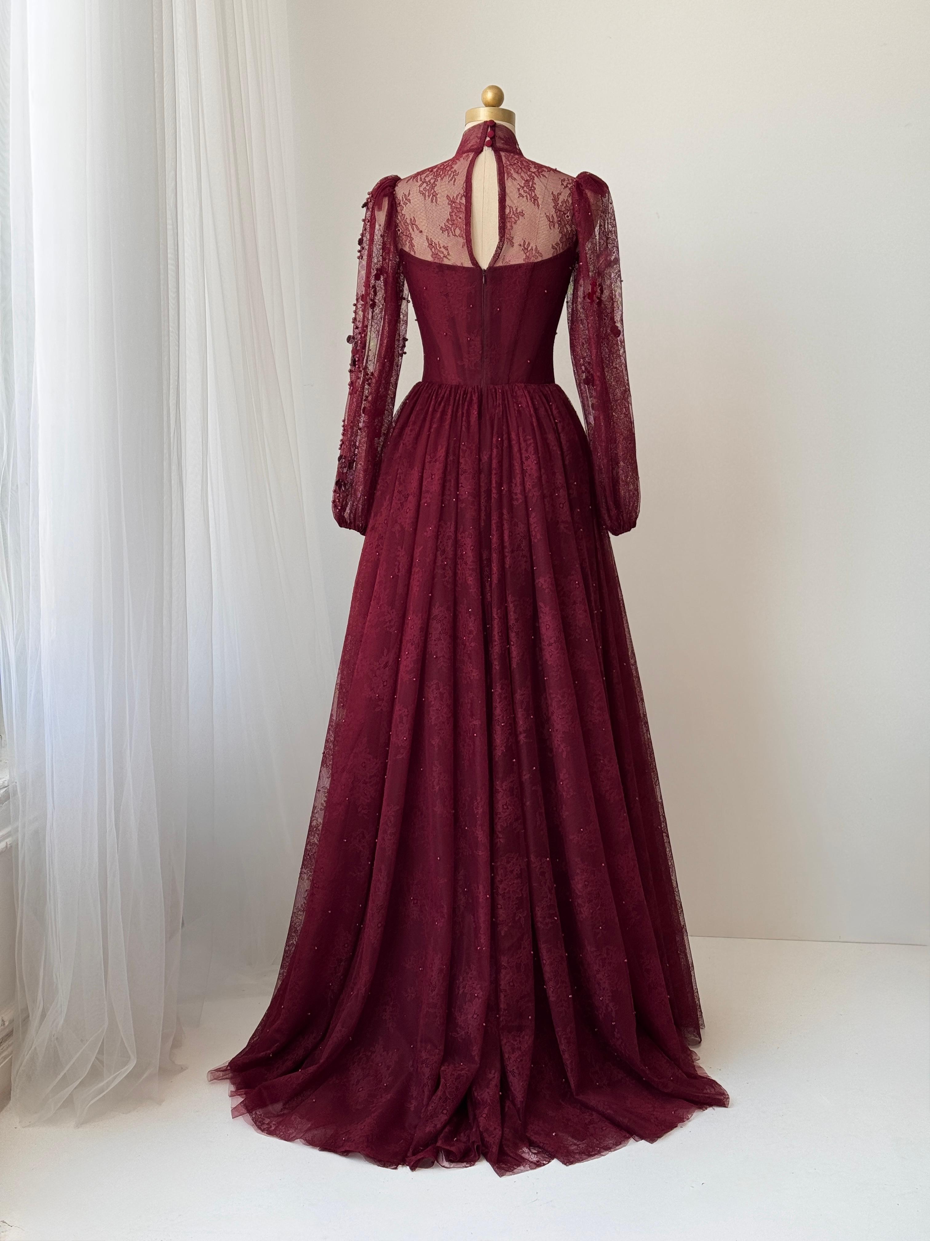 Burgundy A-Line gown with long sleeves and embroidered work