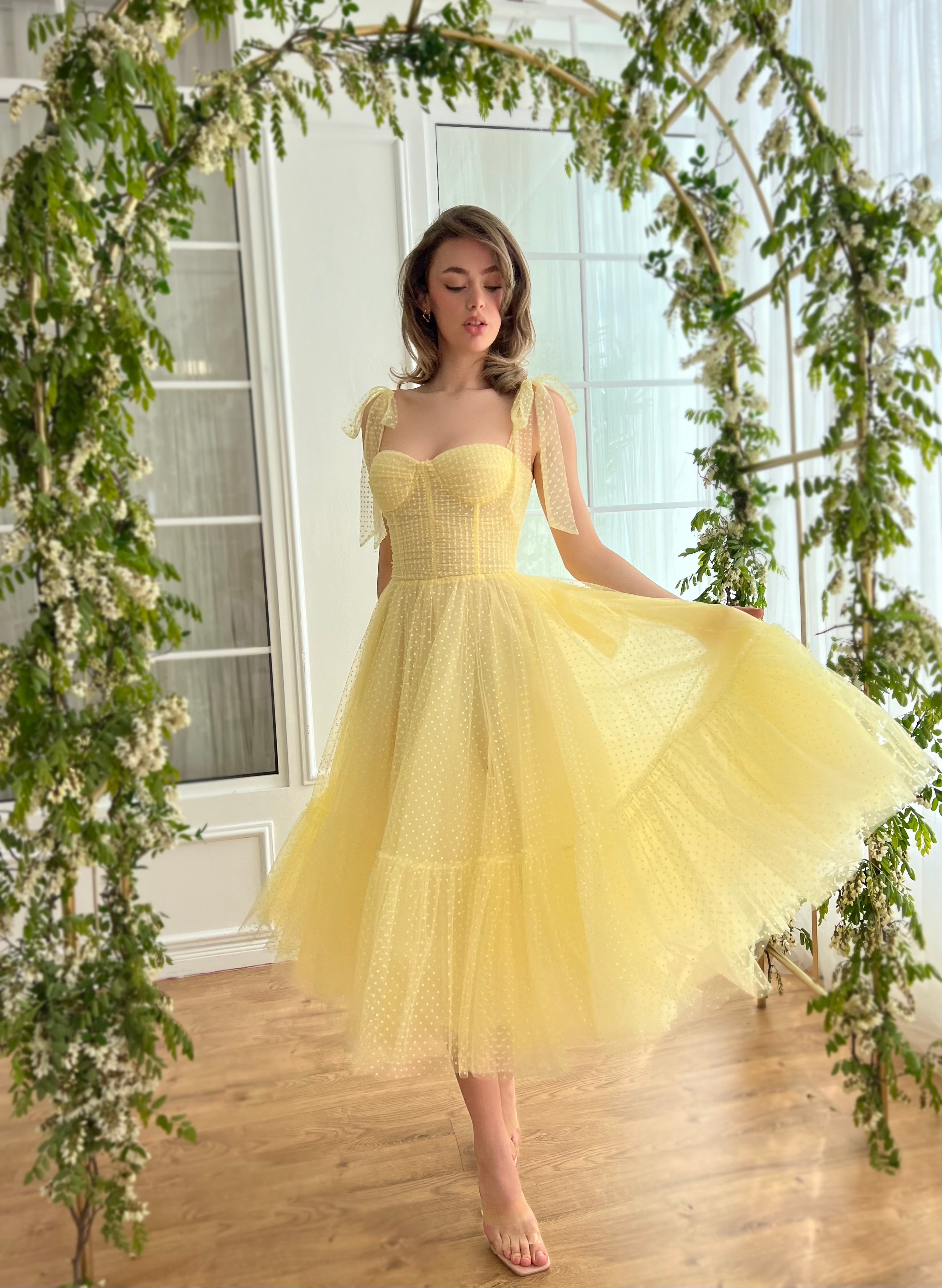 Yellow midi dress with off the shoulder sleeves and embroidery